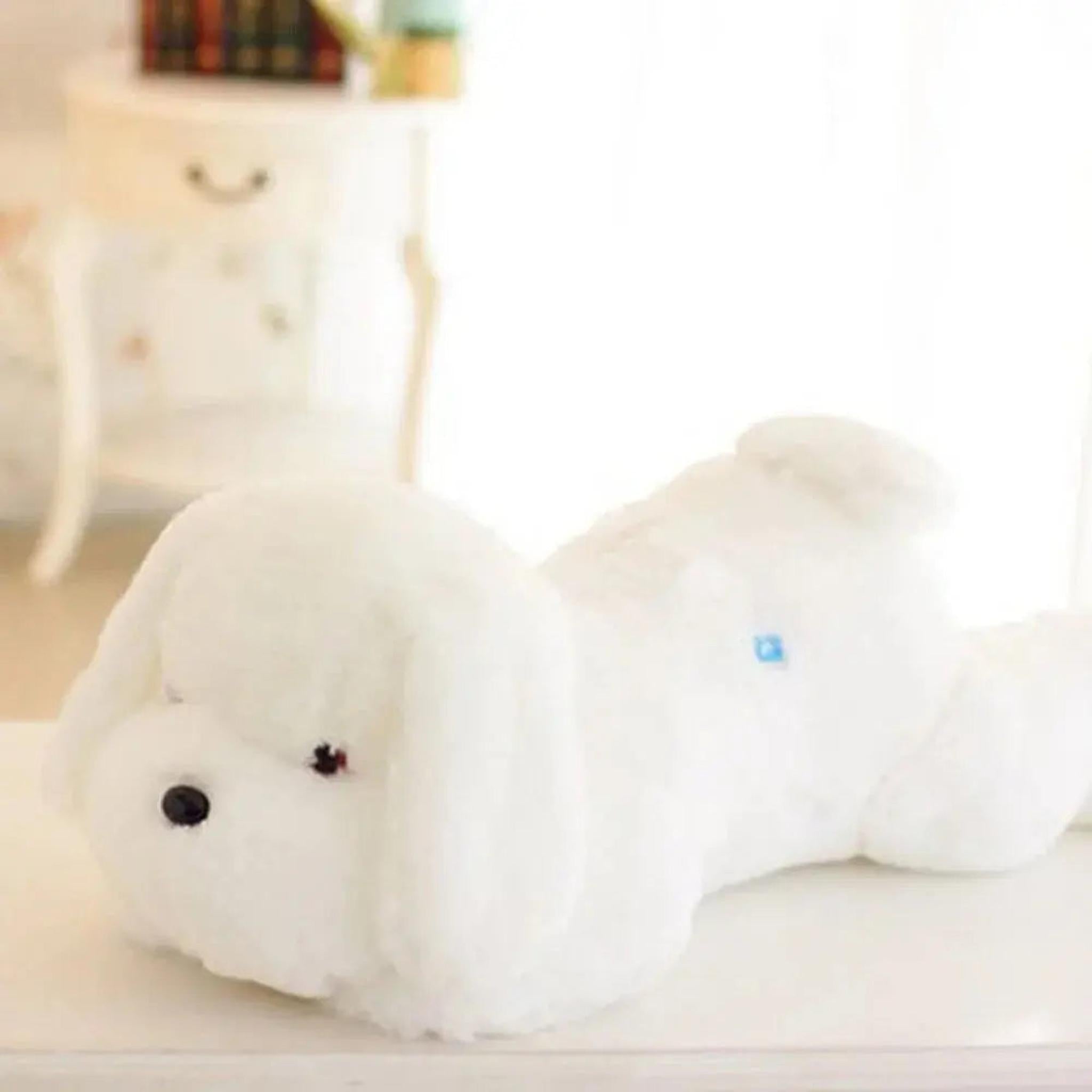 Fluffy white dog plush pillow with a soft, cuddly texture lying on a white surface.