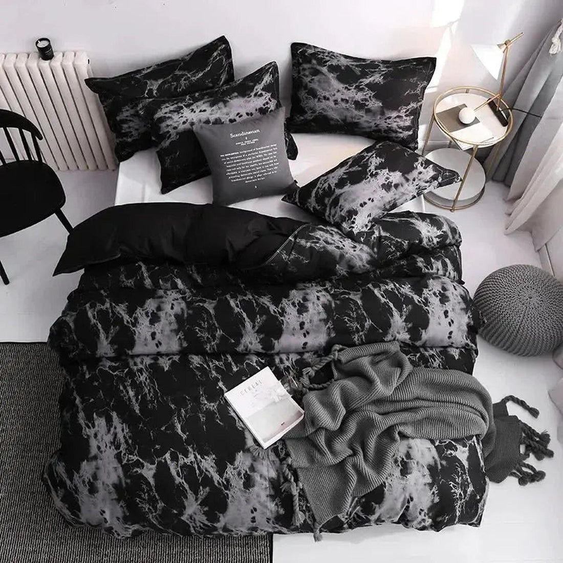 Dark marble print microfiber duvet cover set with shams on a bed in a modern bedroom.