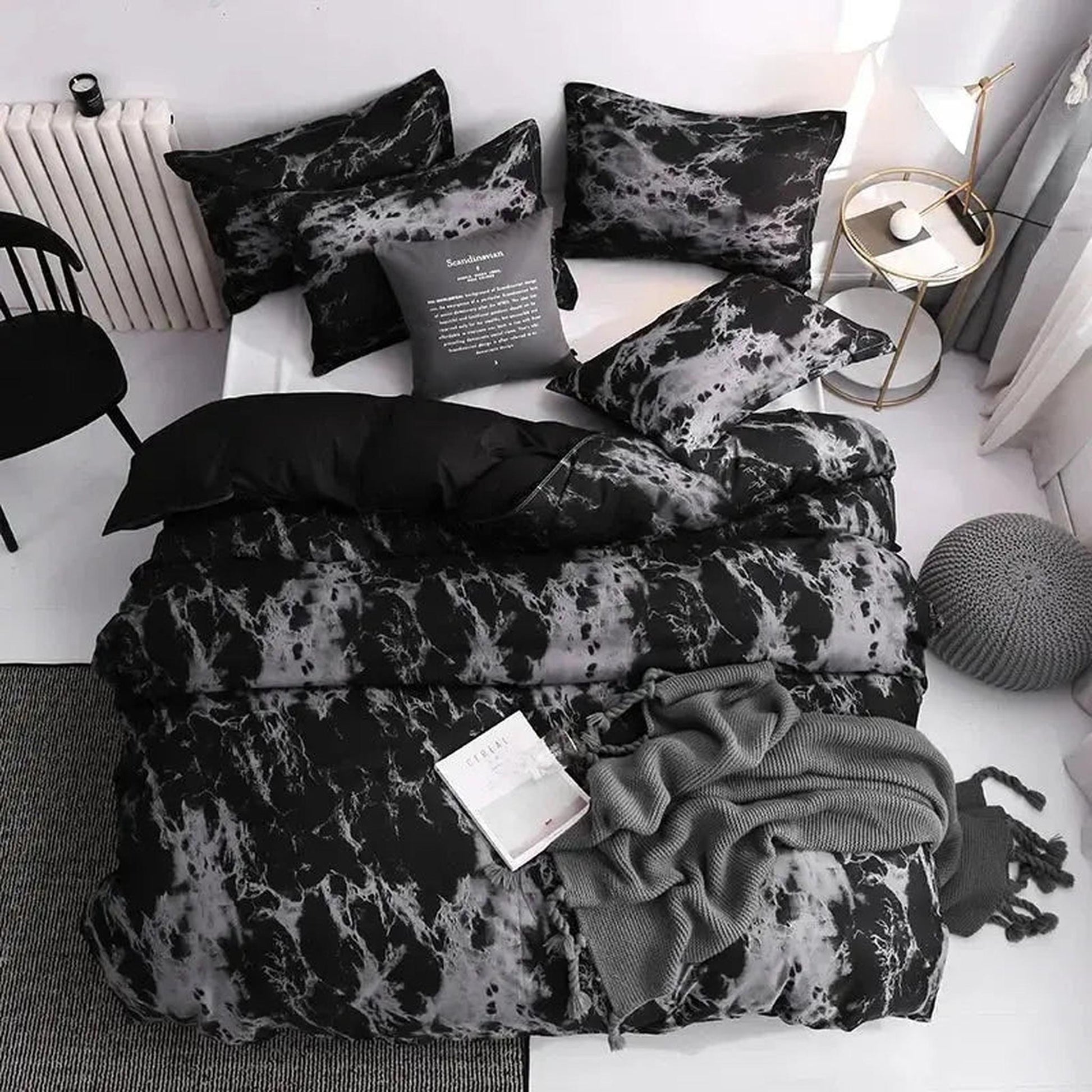 Dark marble print microfiber duvet cover set with matching shams, styled on a bed.