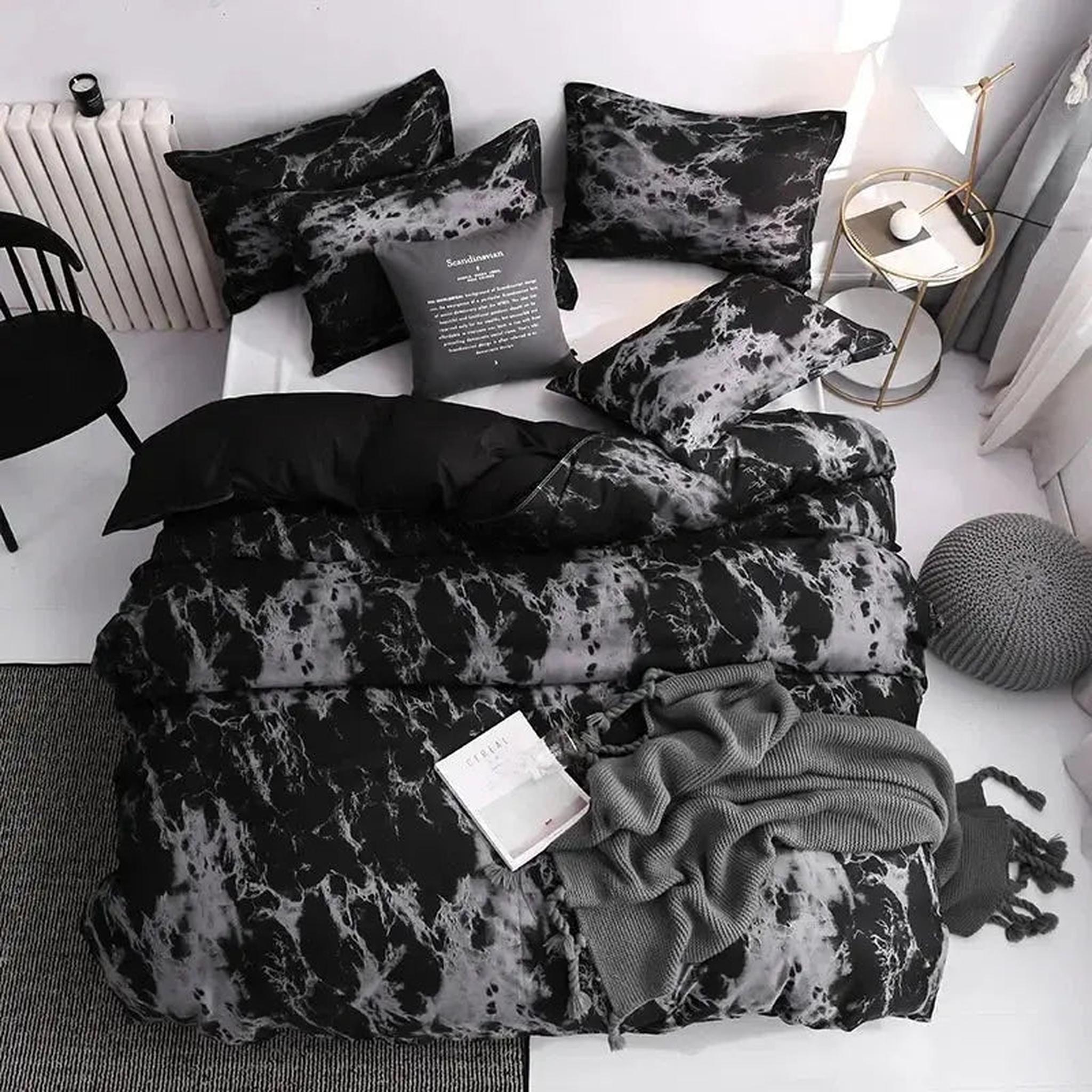 Dark marble print microfiber duvet cover set with matching shams, styled on a bed.