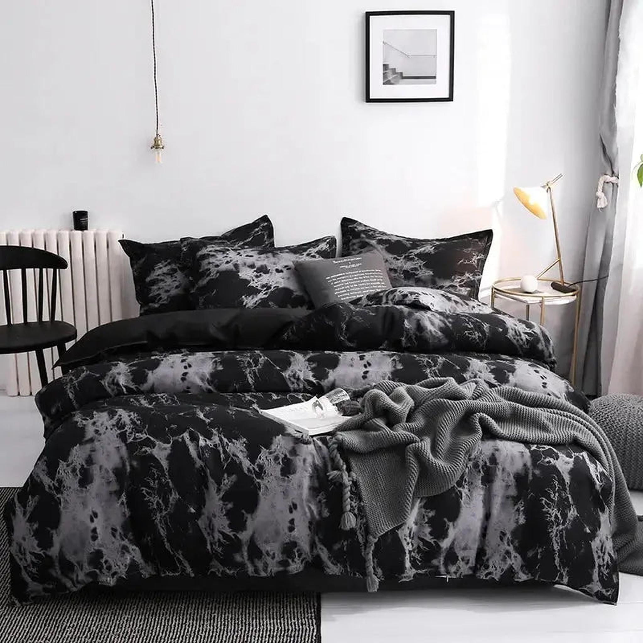 Dark marble print microfiber duvet cover set with two shams on a bed in a modern bedroom.
