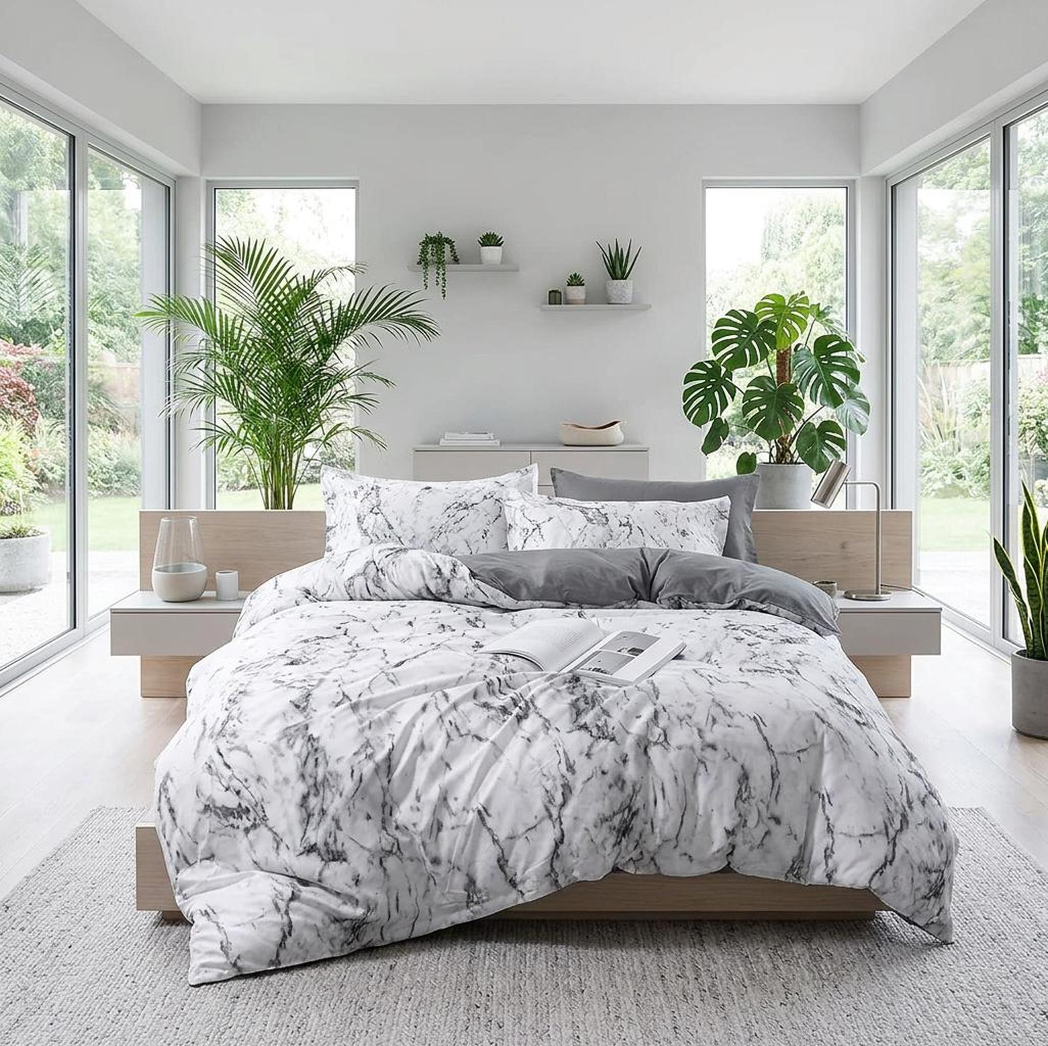 White marble print duvet cover set with grey accents on a modern bed.