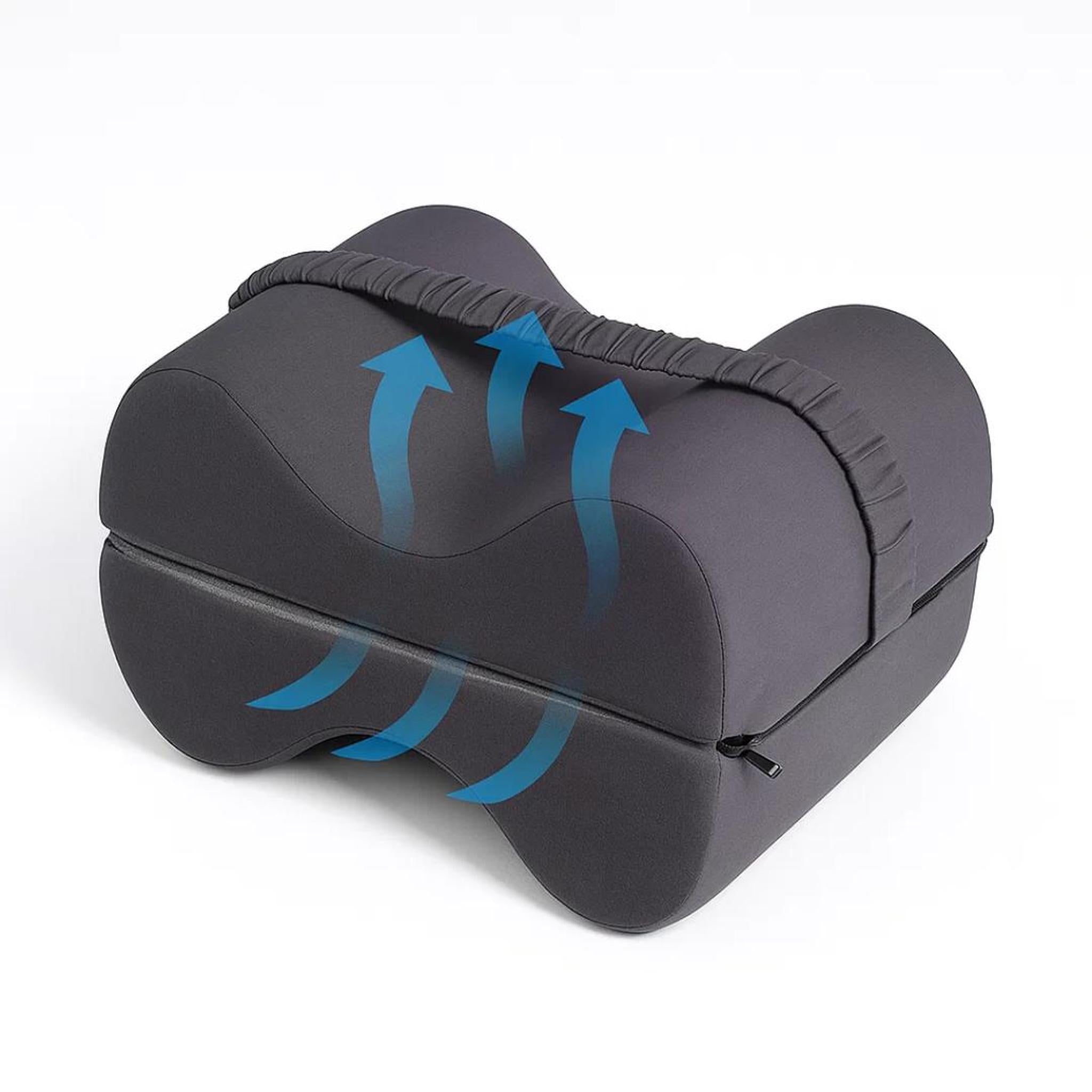 Dark gray memory foam knee pillow with ergonomic design, featuring a strap and airflow arrows.