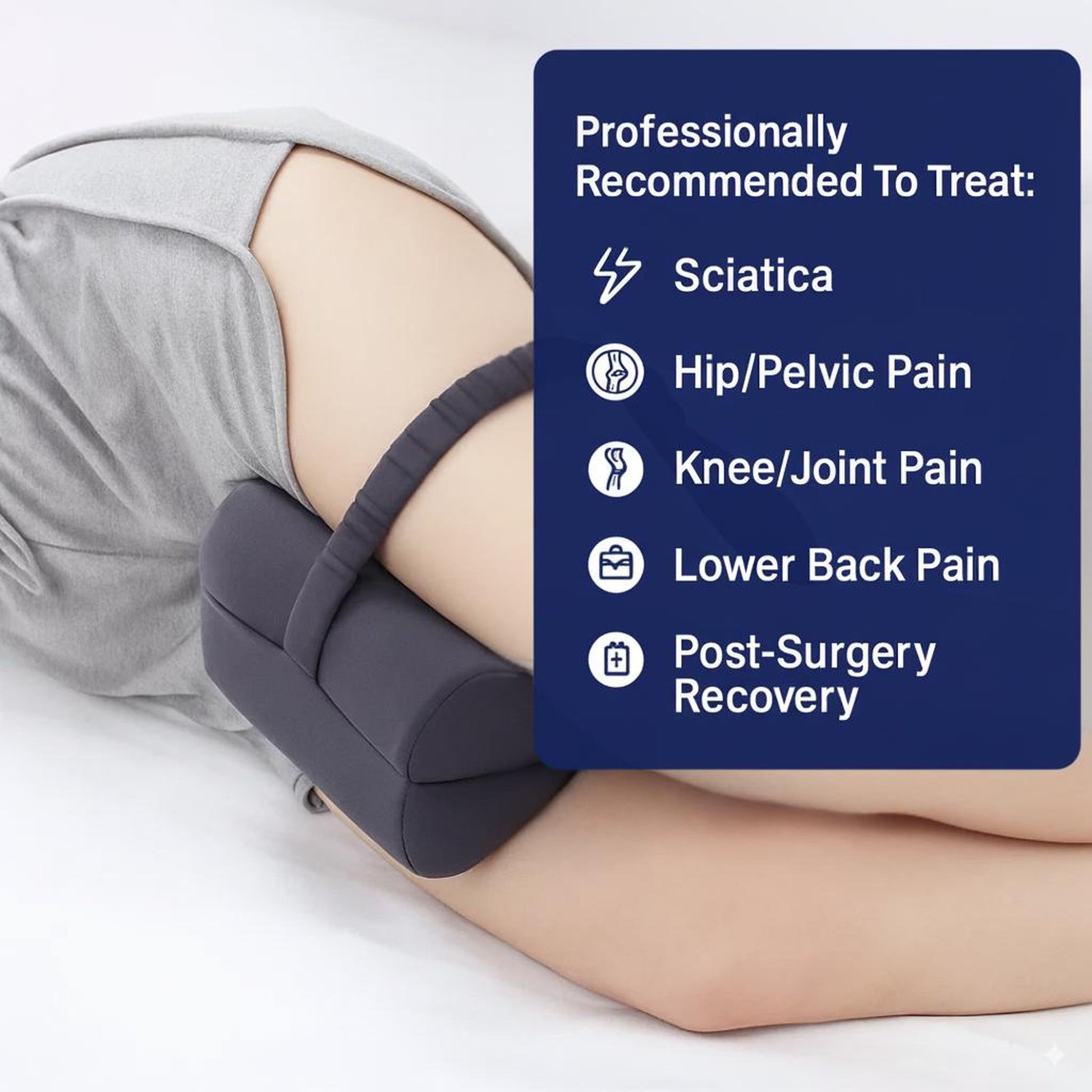 Gray memory foam knee pillow with an adjustable strap, positioned between legs for sciatica and joint pain relief.