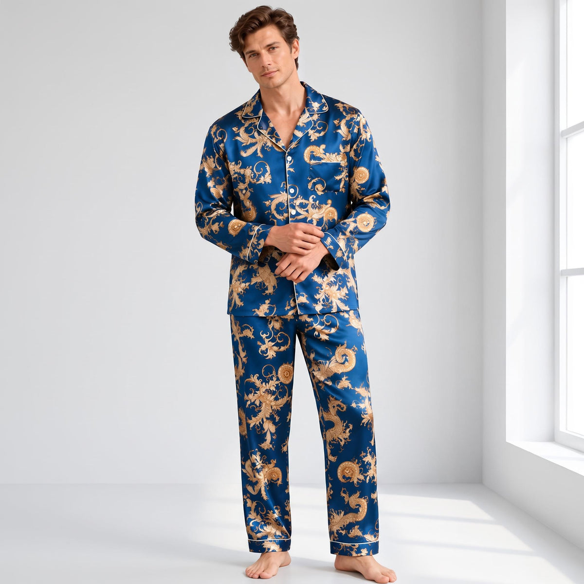 Man wearing a blue and gold dragon print mulberry silk pajama set with a notch collar and button-down front.