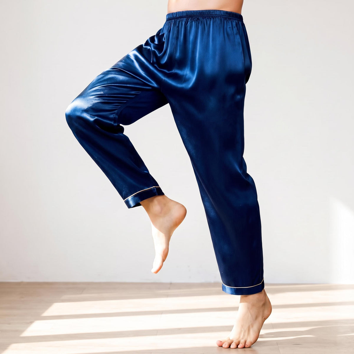 Men's navy blue mulberry silk pajama pants with an elastic waistband and smooth, lightweight finish.