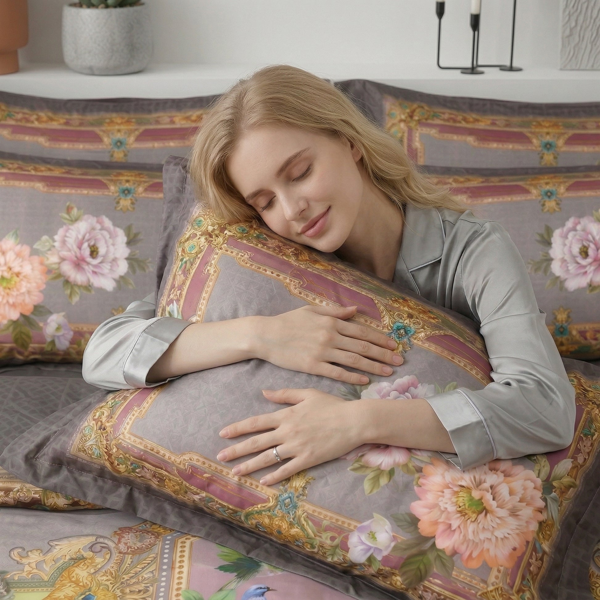 Woman sleeping on a soft, grey Nature Inspired Mosaic Duvet Cover Bedding Set with floral and bird patterns.