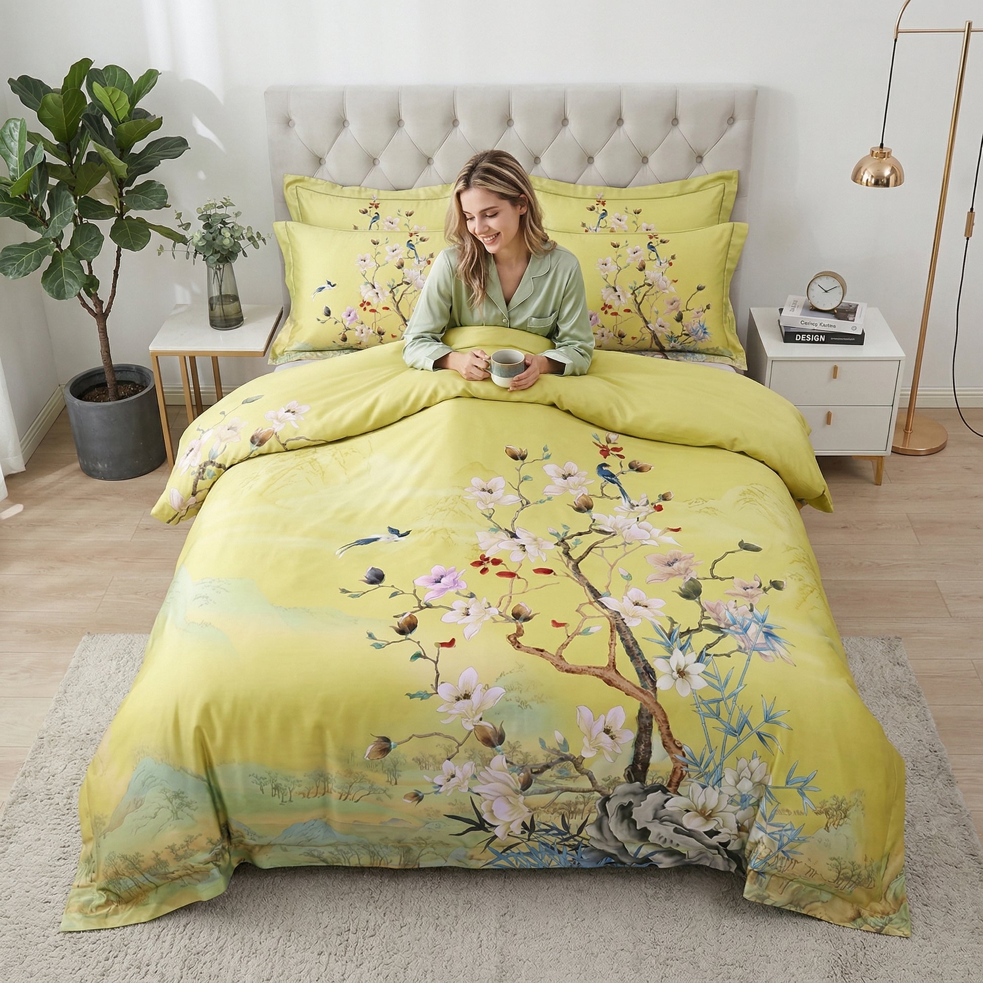 Yellow cotton duvet cover with nature-inspired mosaic birds and floral patterns on a bed.