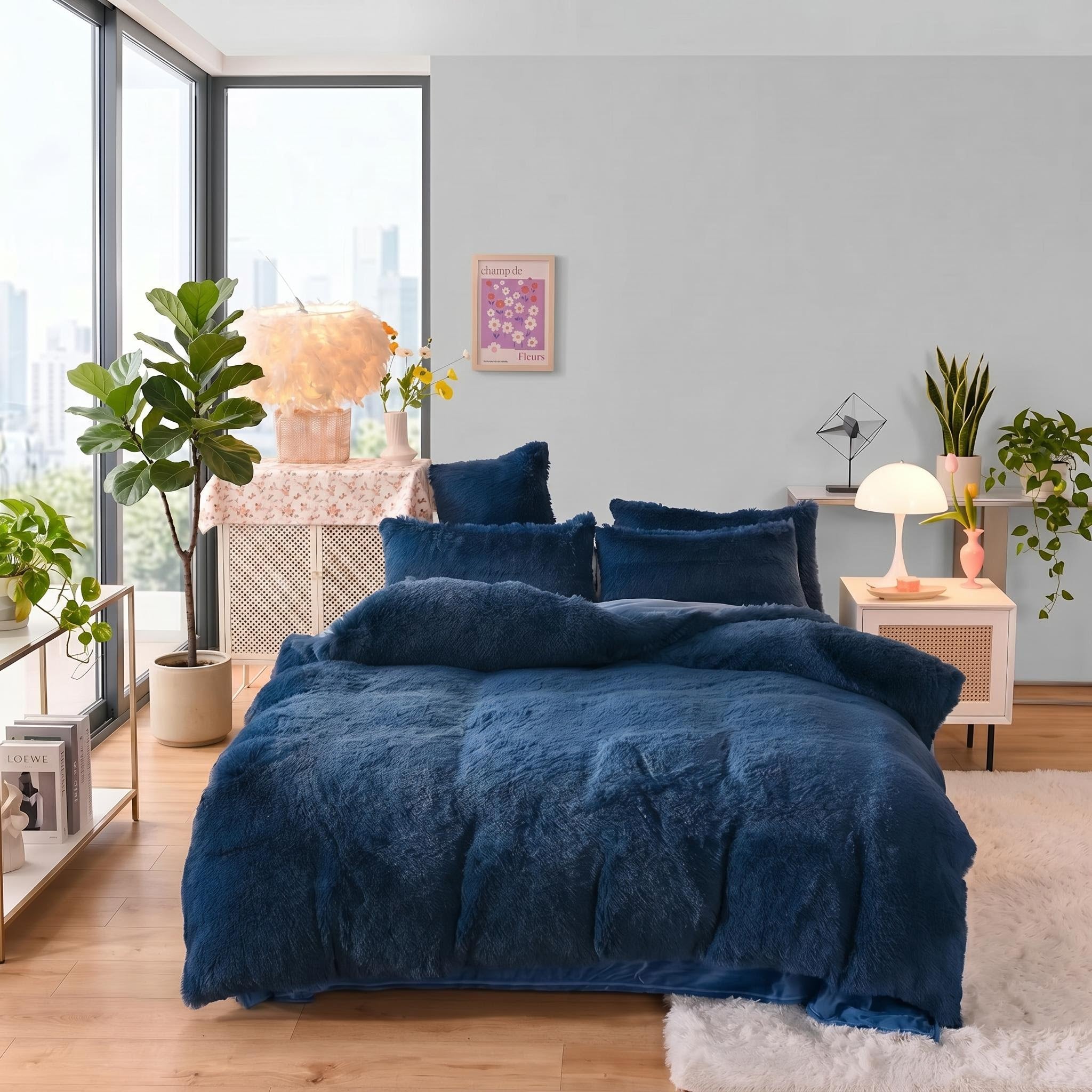 Navy blue reversible faux fur and velvet duvet cover set on a bed in a modern bedroom.