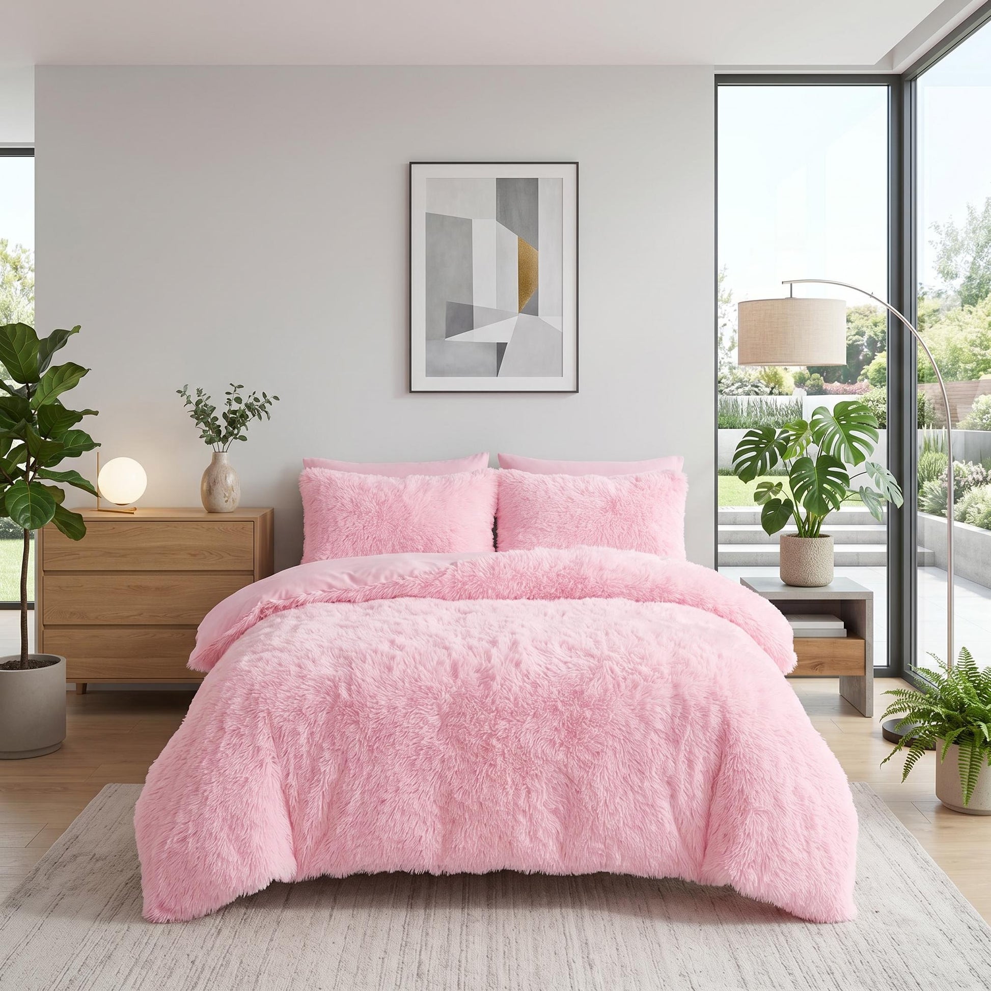 Pink plush faux fur duvet cover set with two pillows on a modern bed.
