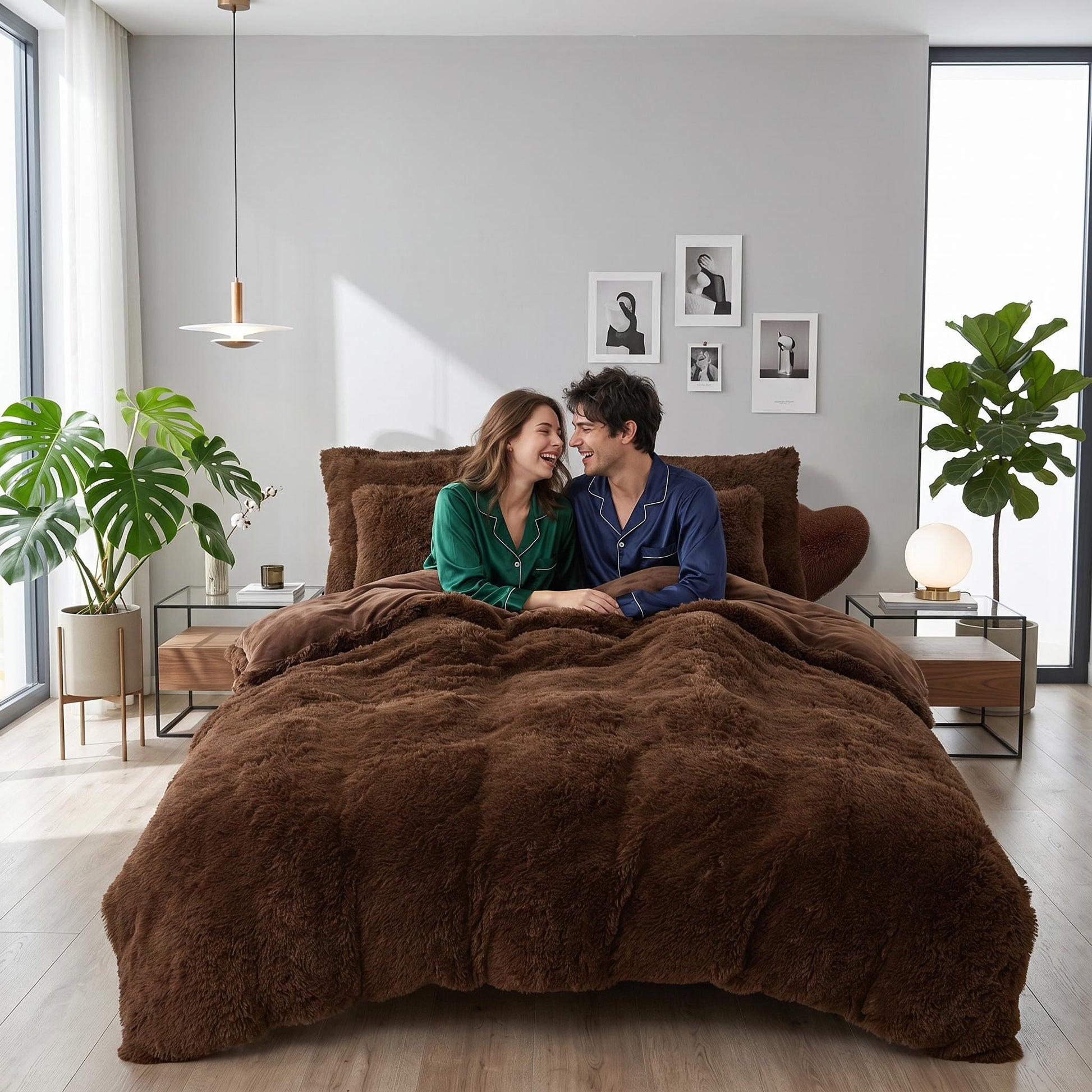 Couple in pajamas on a bed with a brown reversible faux fur and velvet duvet cover set.