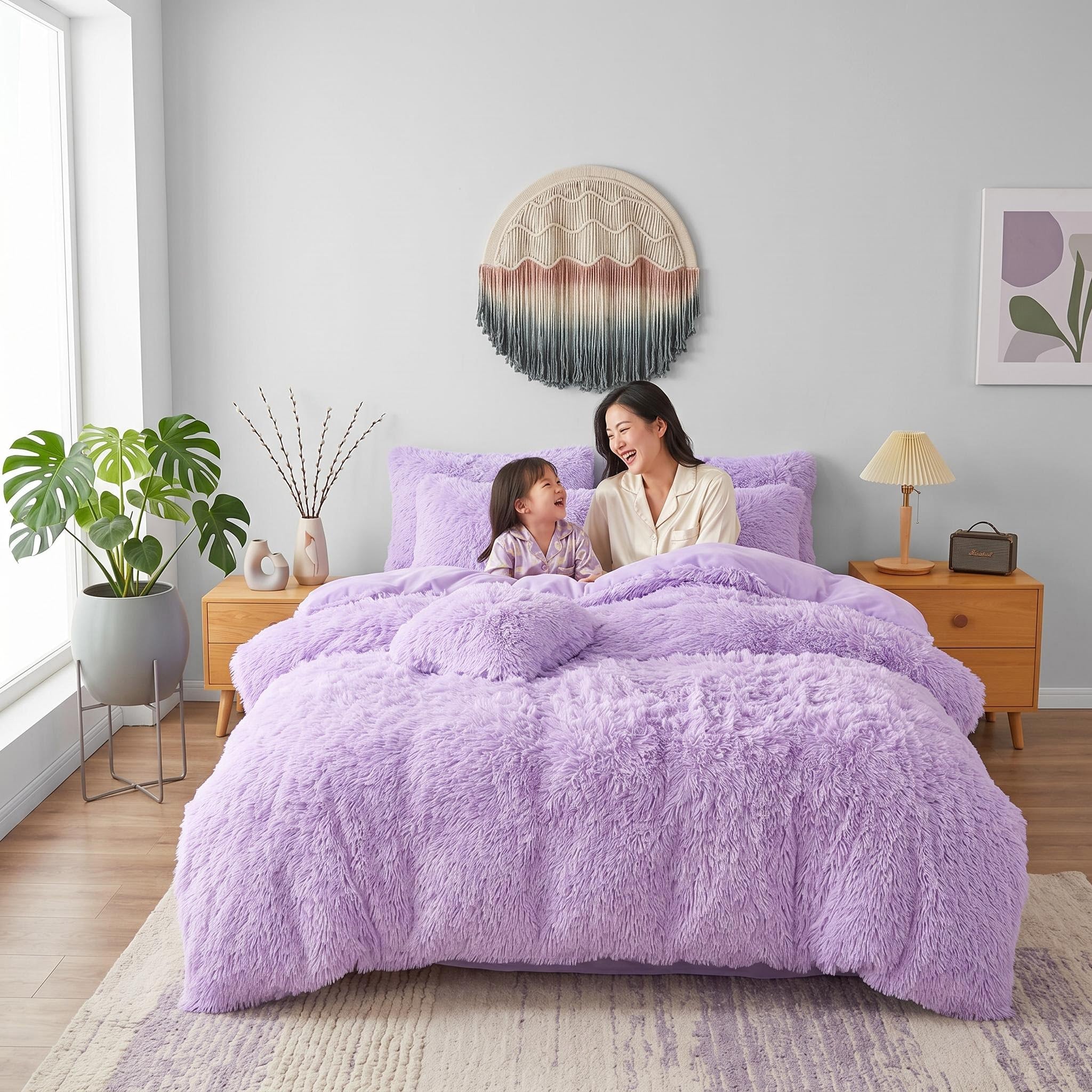 Plush lavender faux fur duvet cover set on a bed with a woman and child.