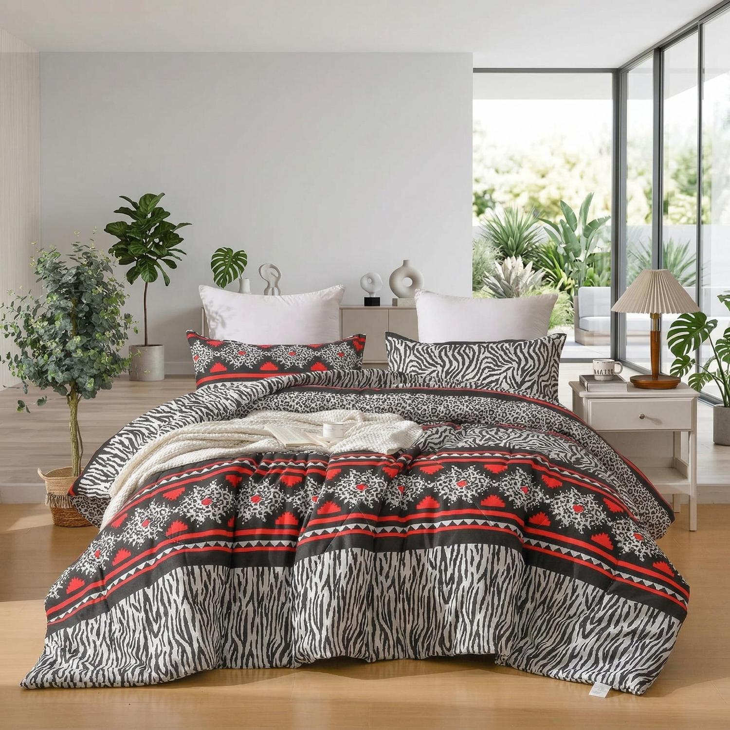 Queen size quilted comforter set with black, red, and white zebra print and geometric patterns.