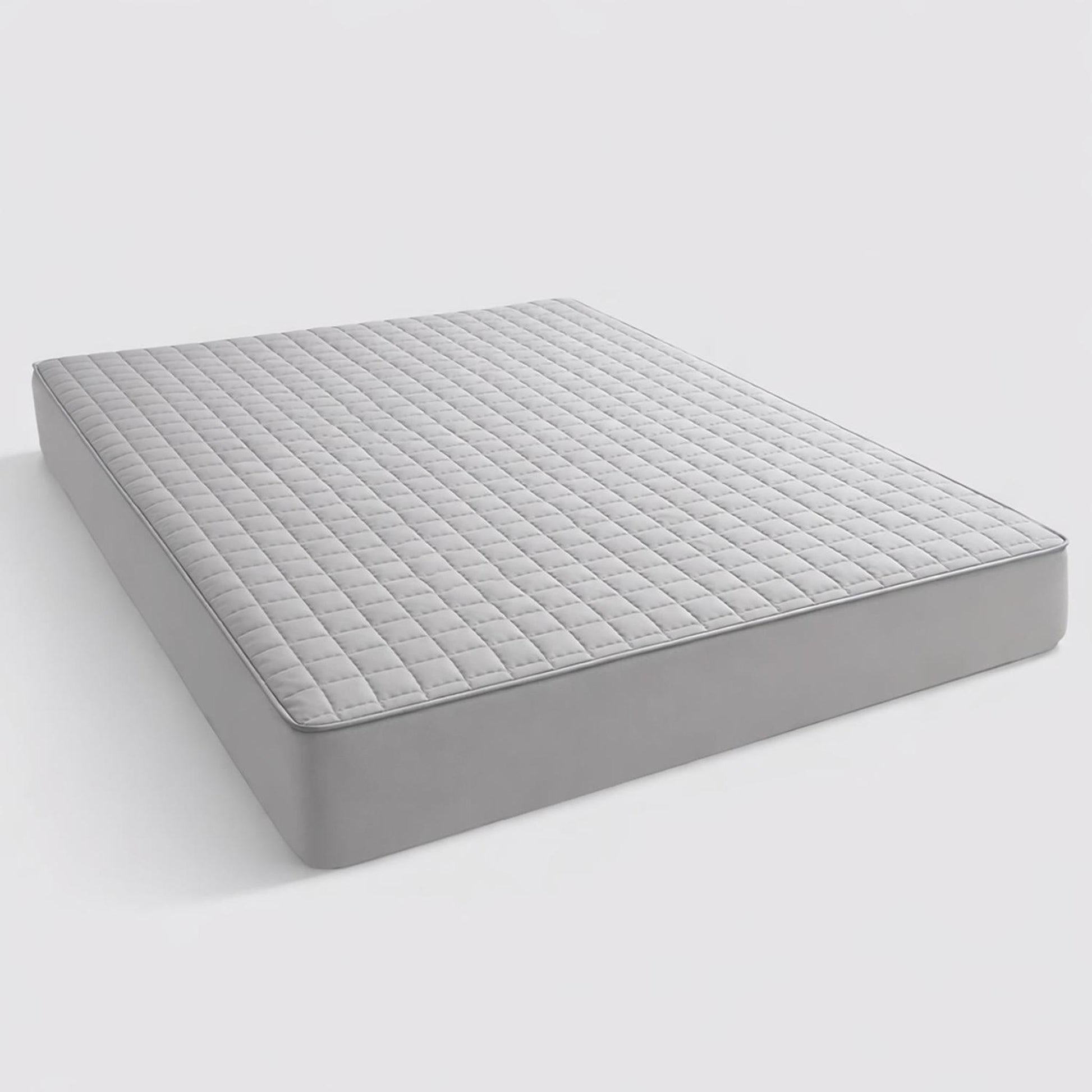 Light gray queen quilted mattress protector with a soft, smooth texture and fitted sheet design.