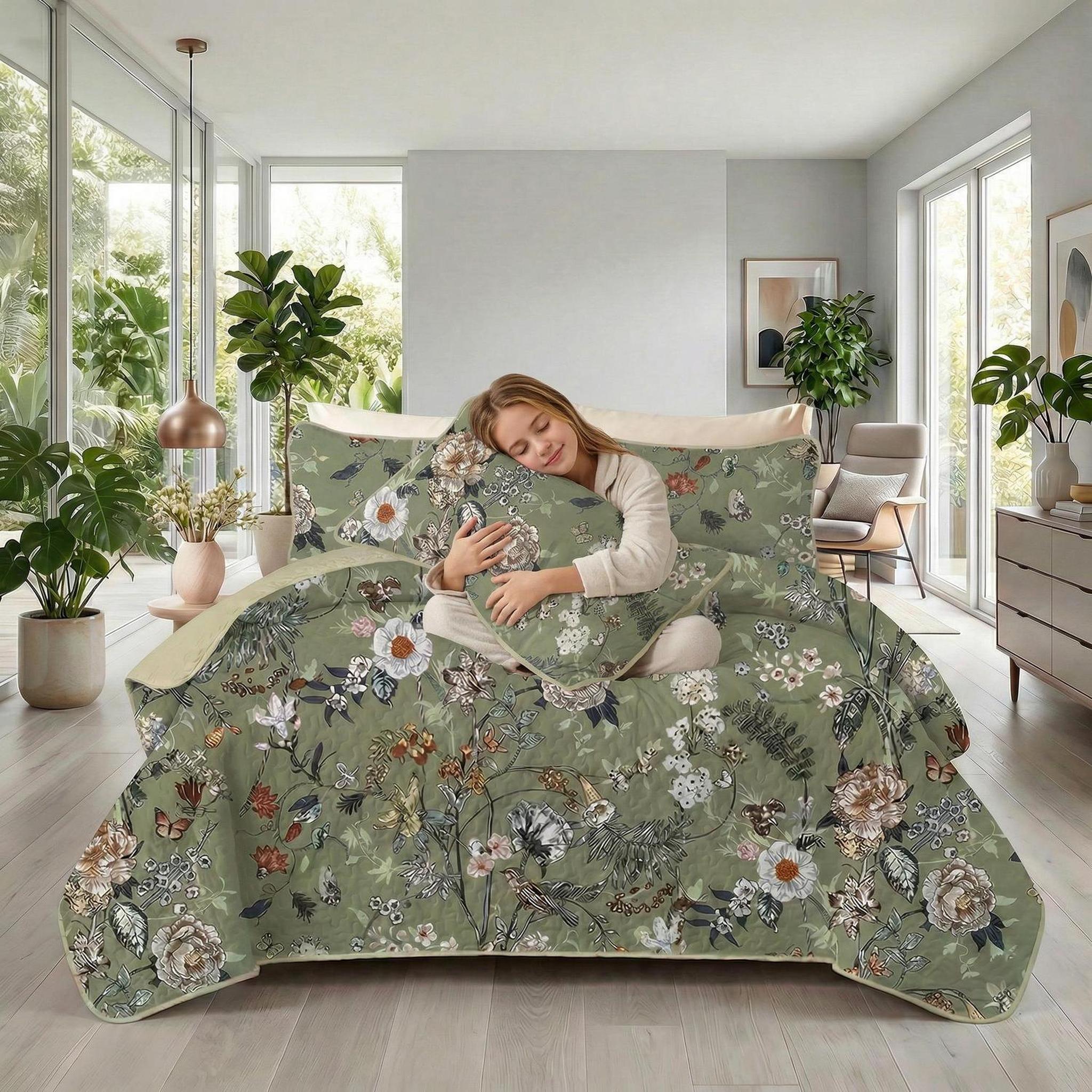 Rainforest floral printed quilt set in sage green with a woman sleeping comfortably.