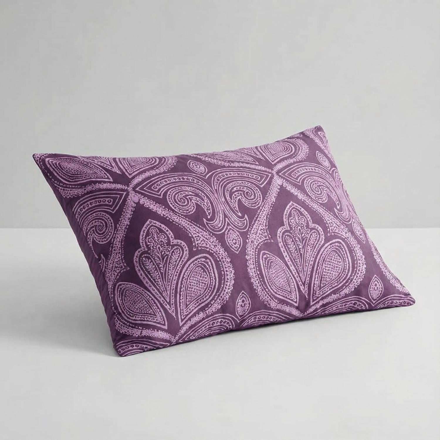 Purple paisley patterned pillow sham from a reversible comforter set.