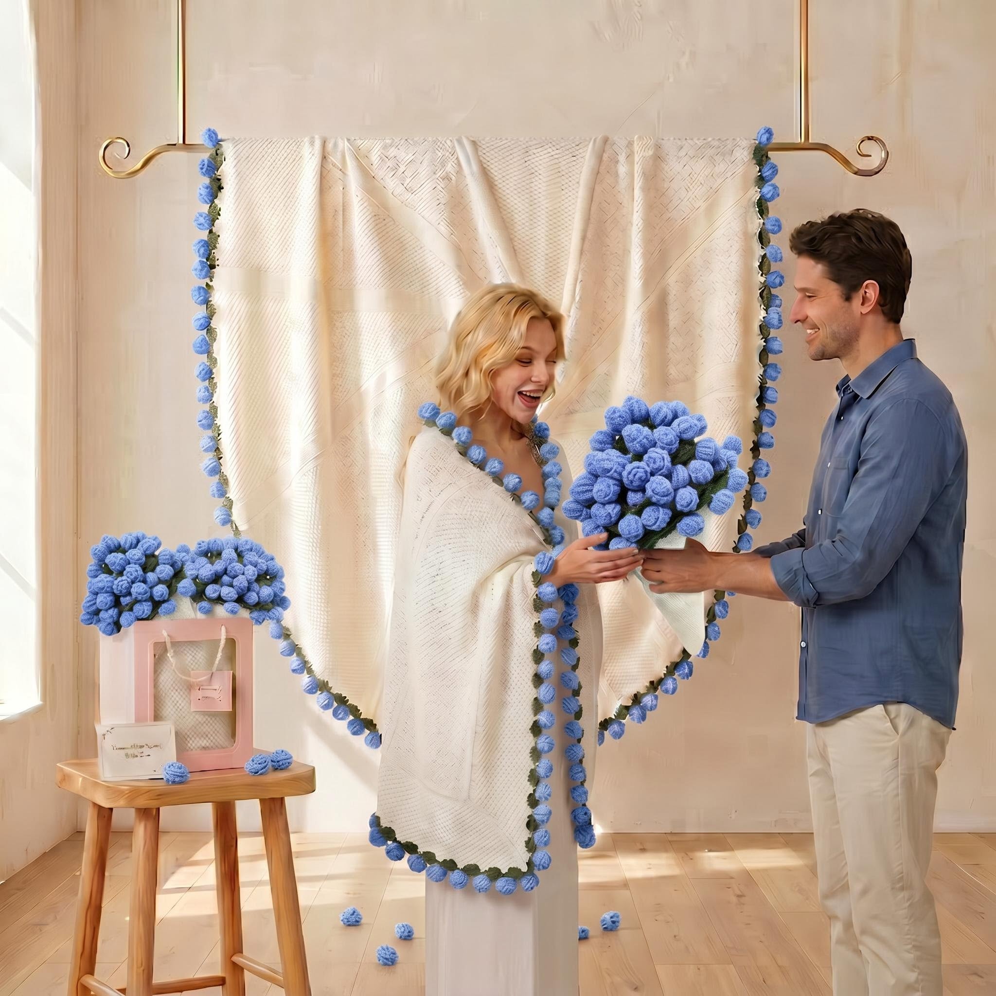 Woman in a white crochet blanket with blue rose trim receiving a blue rose bouquet from a man.