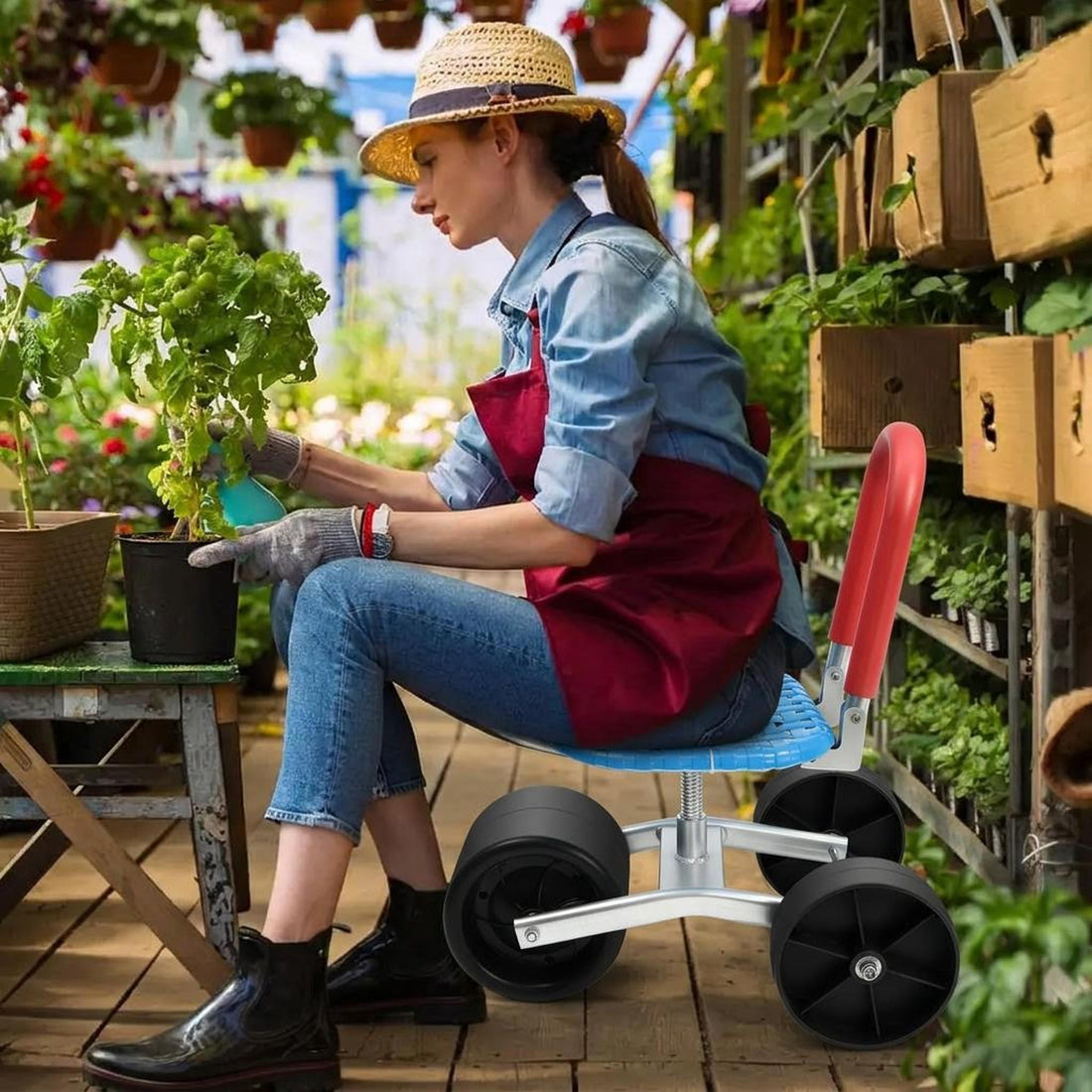 Adjustable rolling garden seat with a blue swivel cushion, red handle, and black wheels in a lush backyard garden.