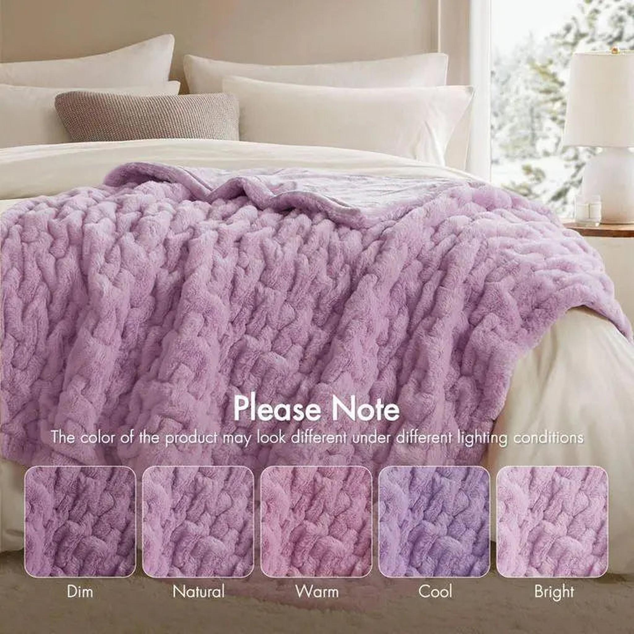 Soft, ruched lavender faux fur throw blanket draped on a bed, with color swatches showing lighting variations.