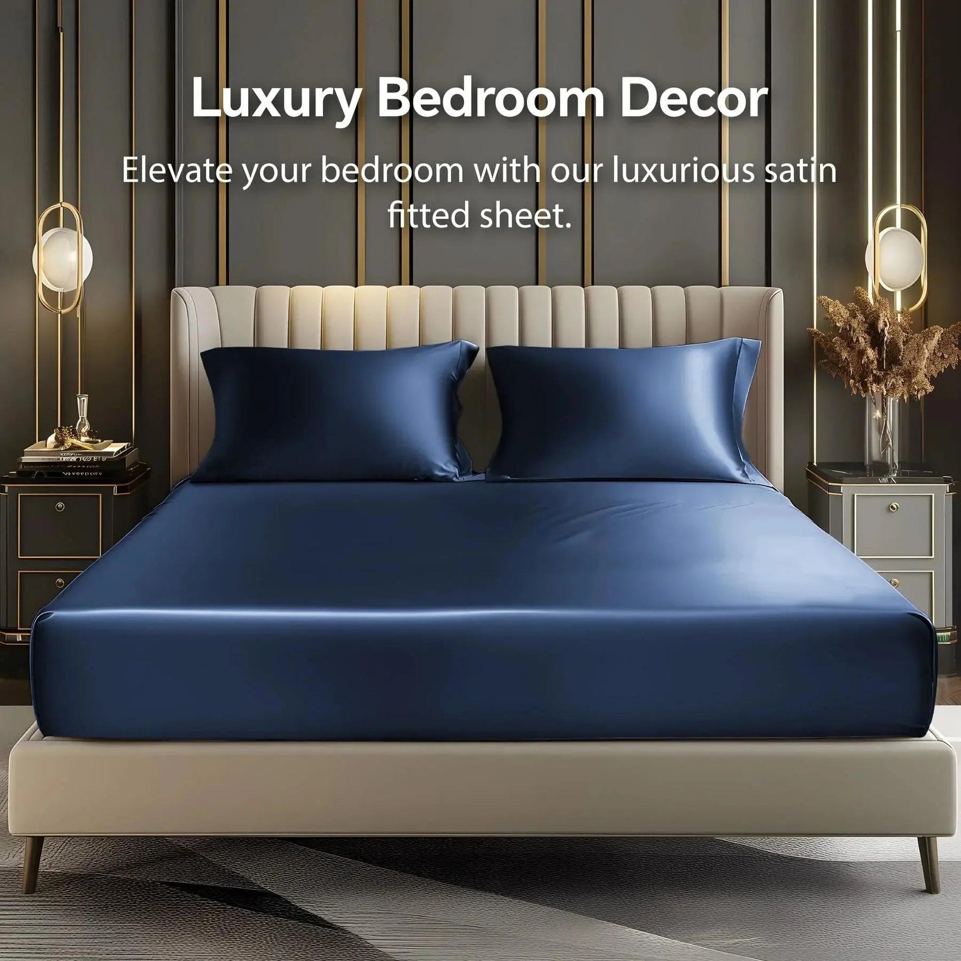 Deep pocket navy blue satin fitted sheet set with two pillowcases on an elegant bed.