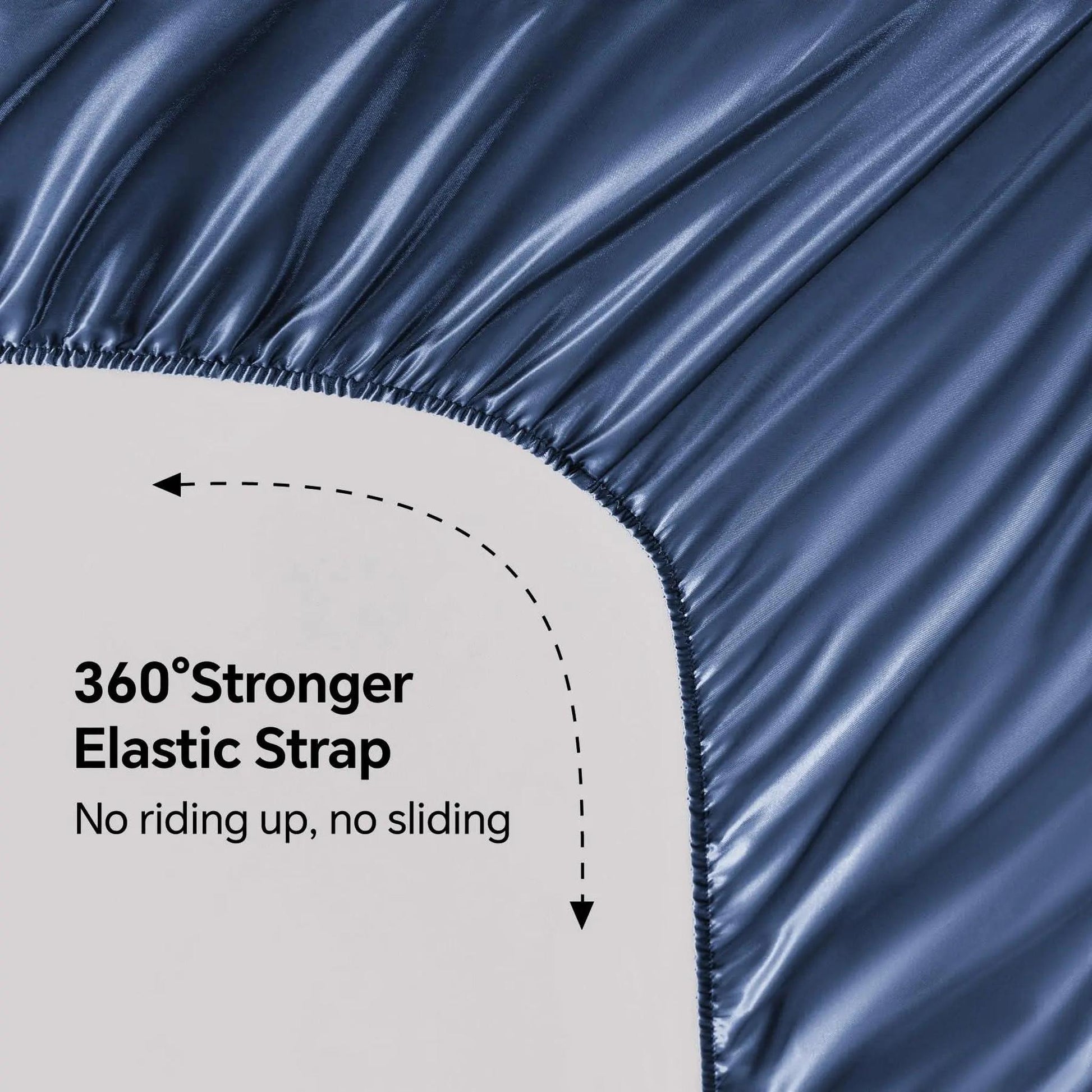 Close-up of a navy blue satin fitted sheet with a 360° stronger elastic strap for a secure fit.