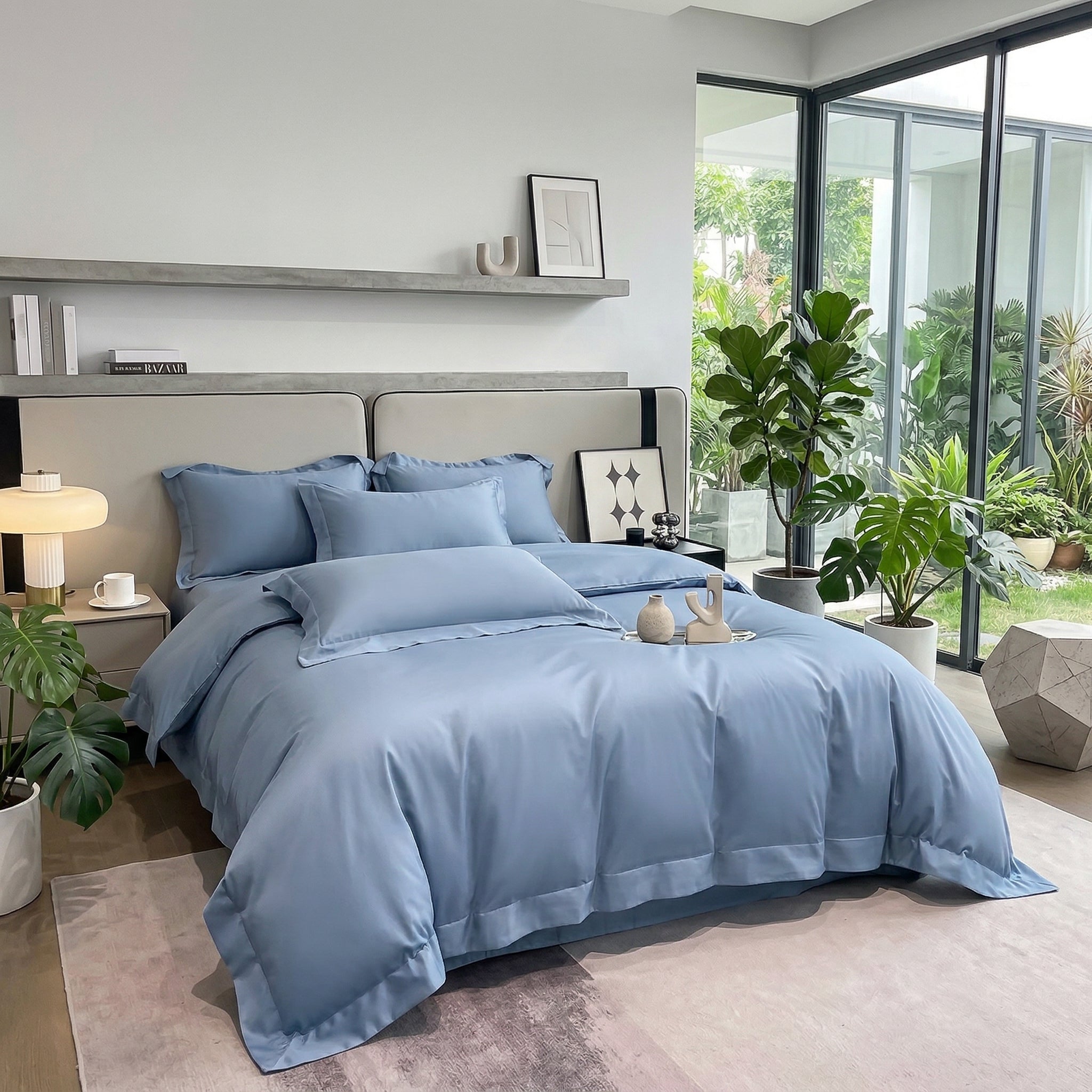 Light blue solid color all-cotton duvet cover bedding set on a bed in a modern bedroom.