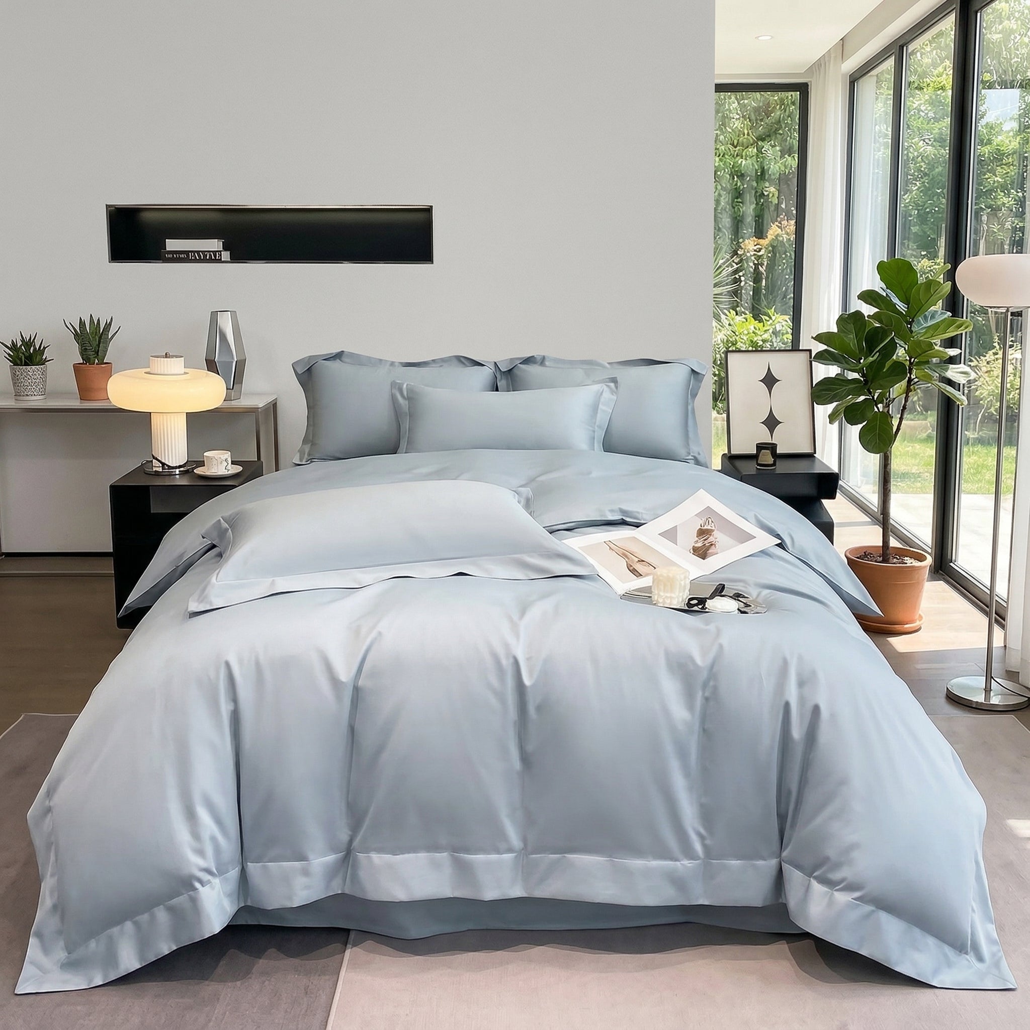 Light blue solid color all-cotton duvet cover bedding set on a bed in a modern bedroom.