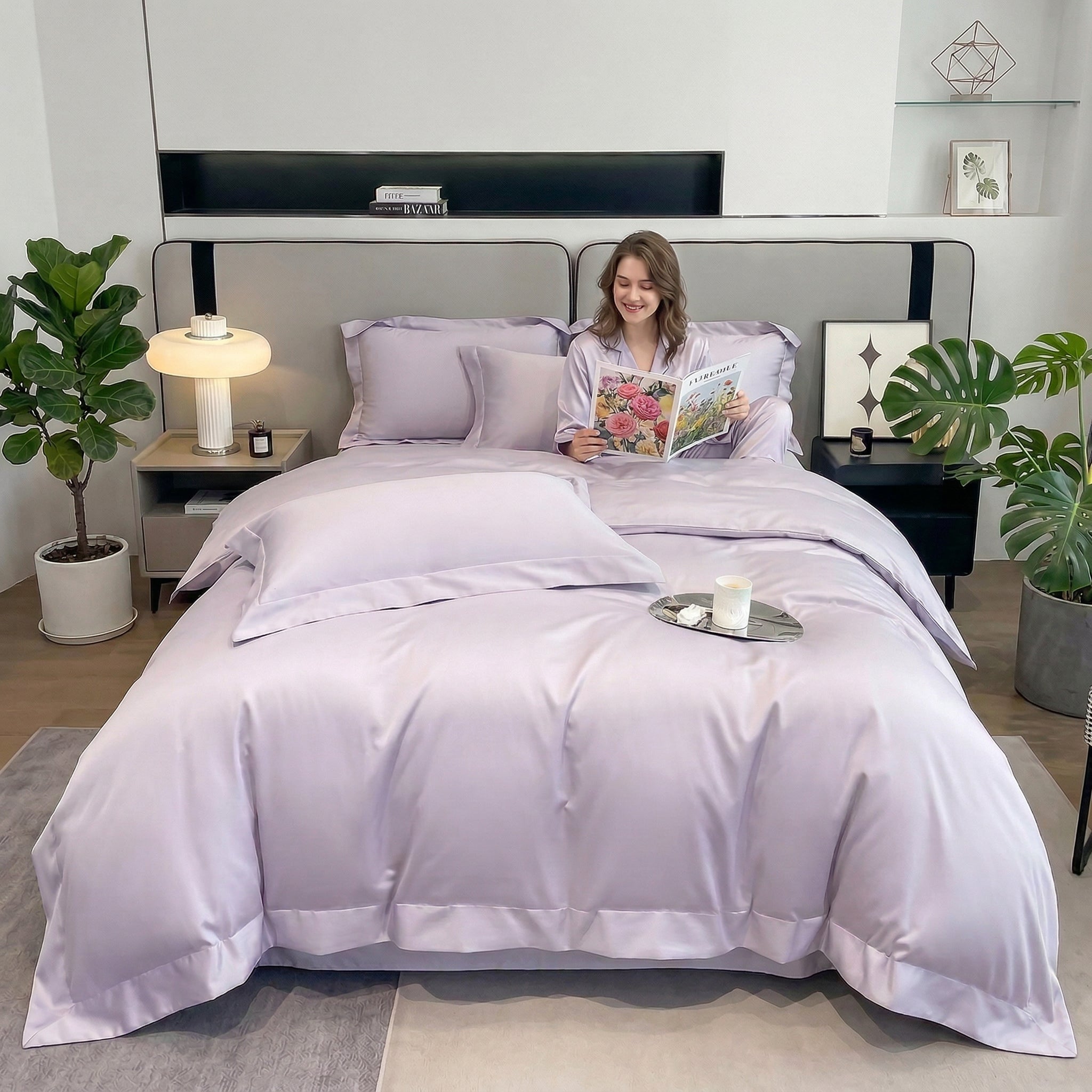 Woman in a modern bedroom on a bed with a soft, solid lavender cotton duvet cover set.