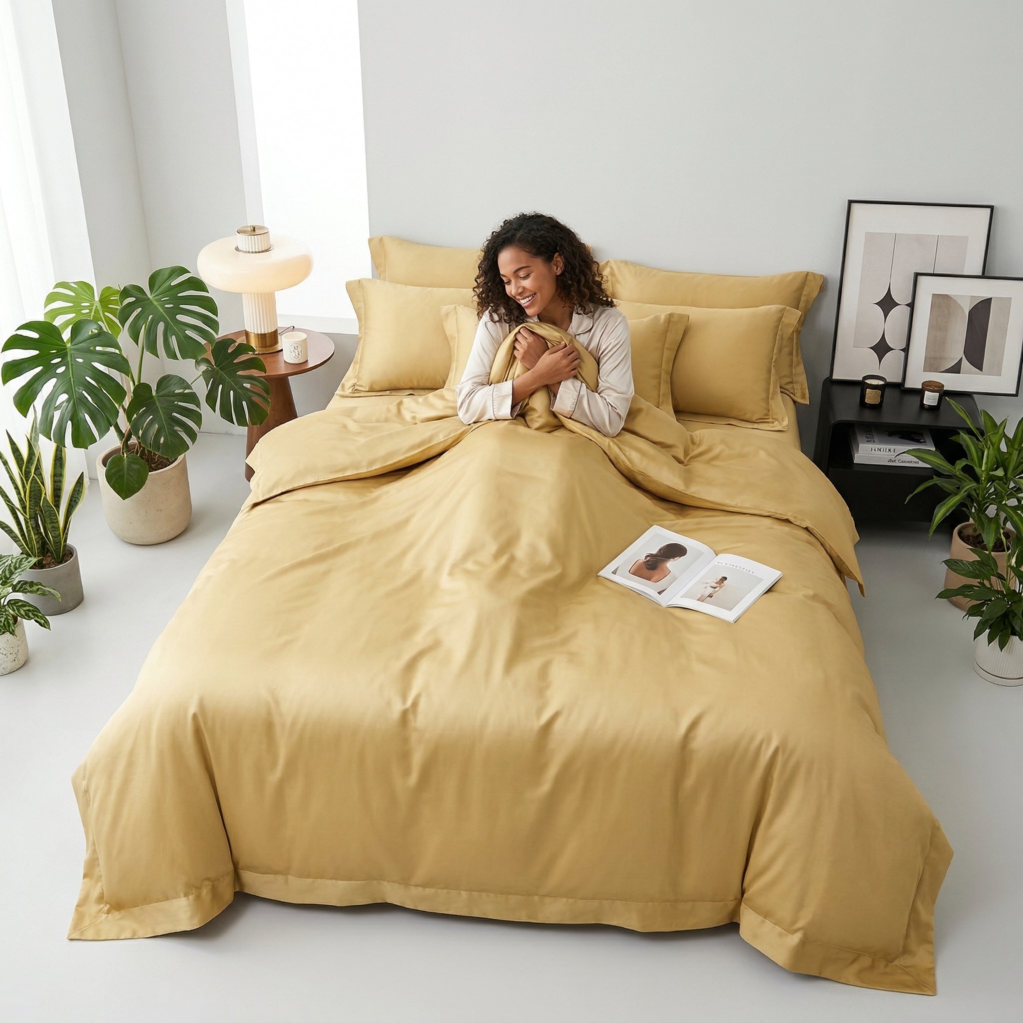 Smiling woman in a modern bedroom with a soft, solid gold cotton duvet cover bedding set.