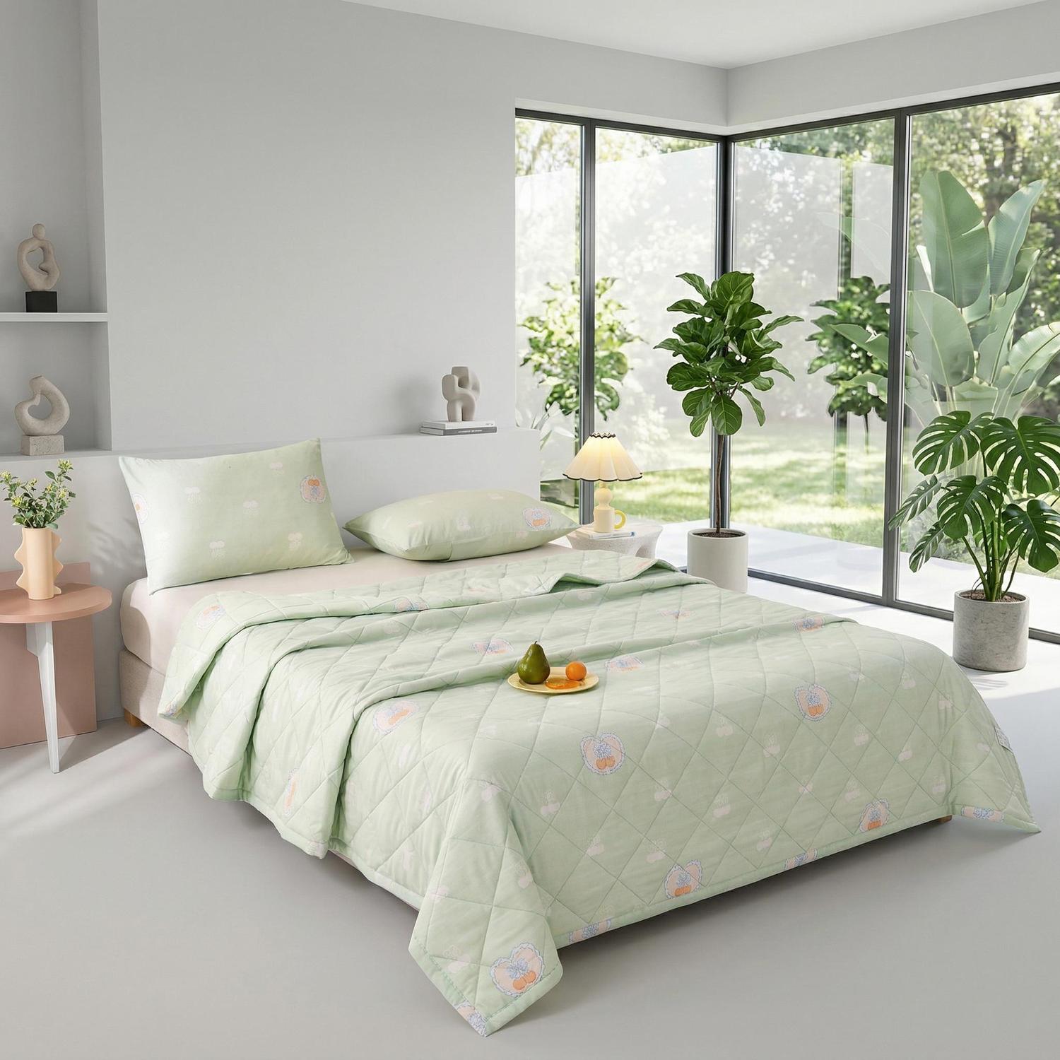 Light green ultrasonic quilted summer comforter with playful bear and cloud pattern, pillow, and cushion on a bed.