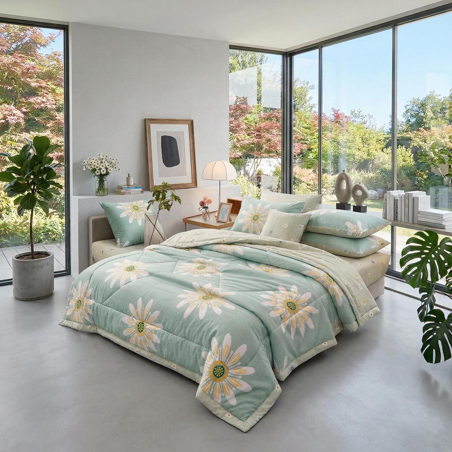 Light green cooling quilt blanket with yellow daisy floral print in a bright bedroom.