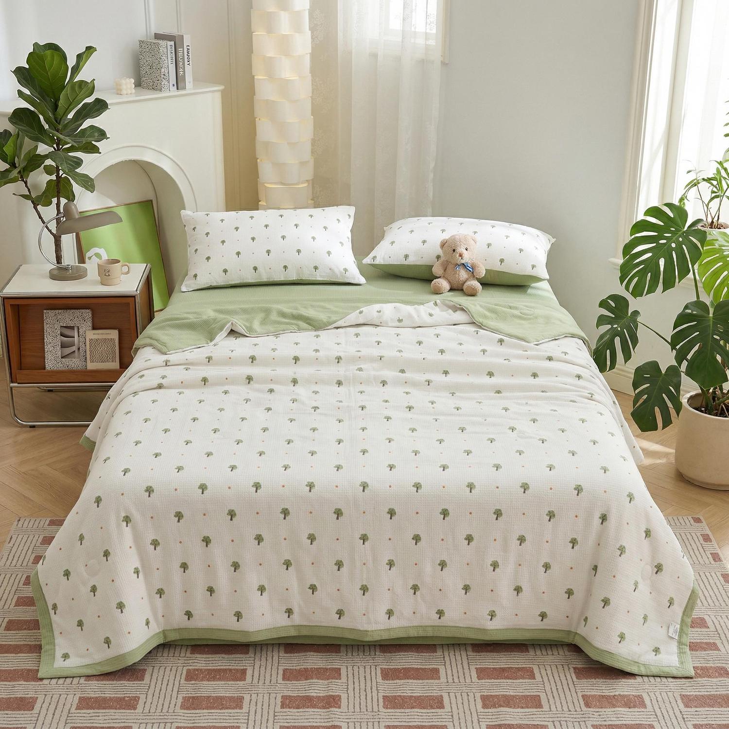White and green Summer Inspired Quilt Bedding Set with small tree patterns, two pillowcases, and a teddy bear.