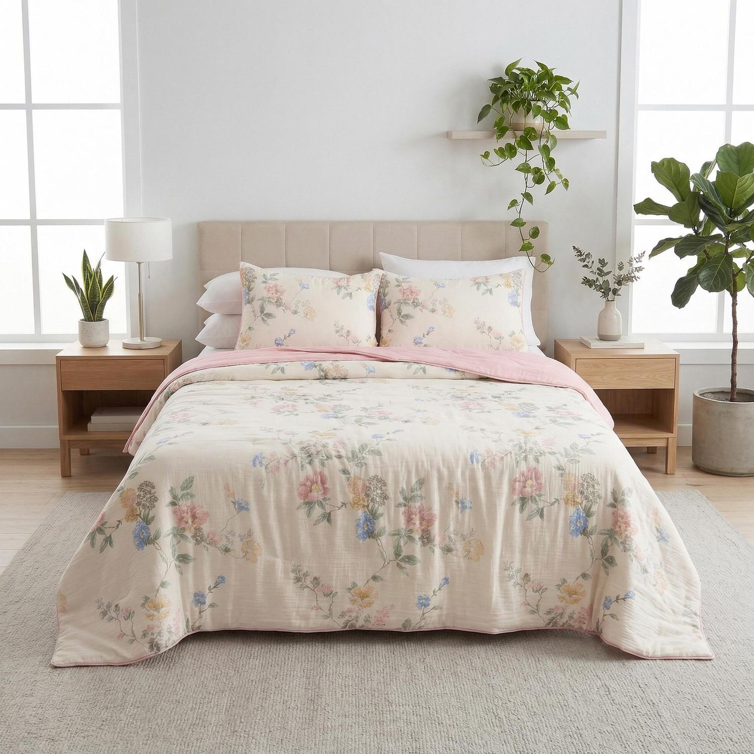 Queen size Summer Inspired Quilt Bedding Set with light floral print, pink reverse, and two pillowcases.