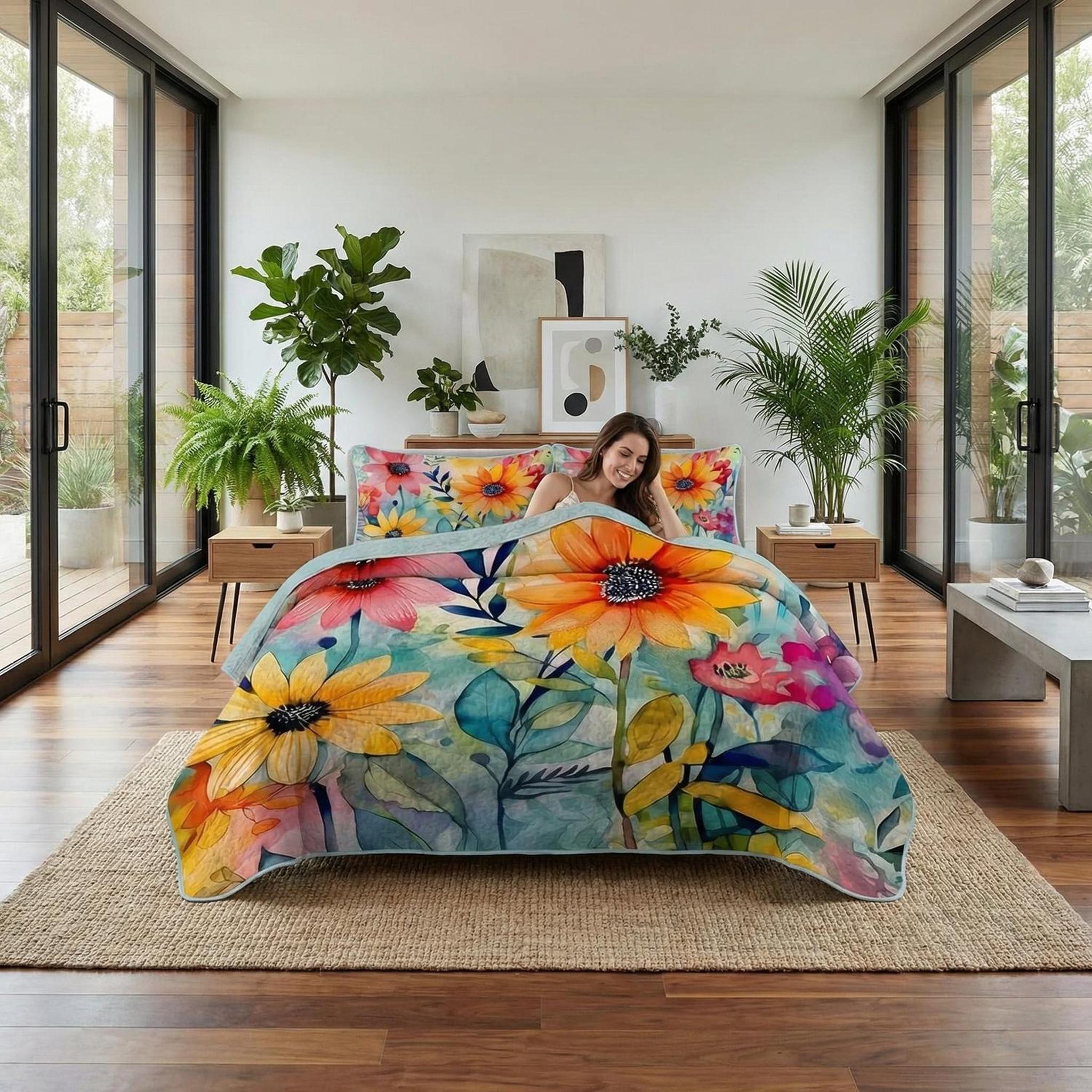 Vibrant sunflower printed microfiber quilt set with pillowcases on a bed in a bright, modern bedroom.