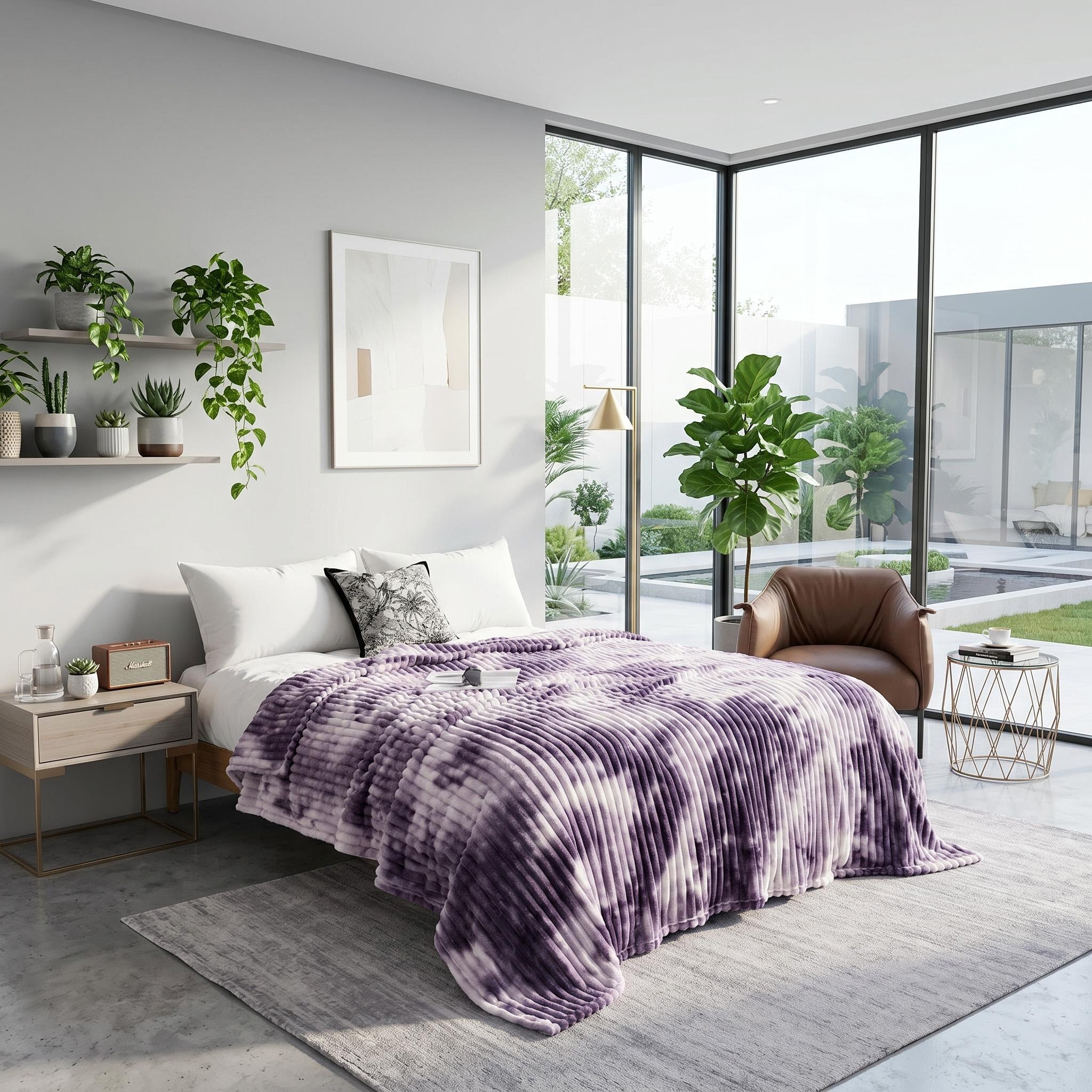 Purple and white tie-dye flannel fleece blanket draped on a bed in a modern bedroom.