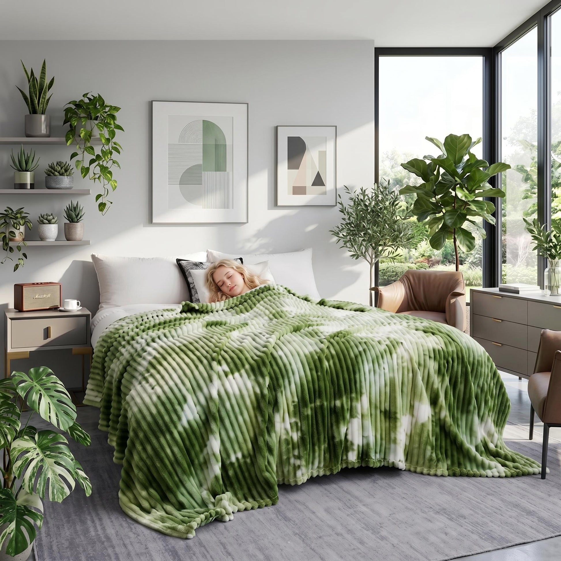 Green and white tie-dye flannel fleece blanket draped over a bed with a person sleeping.