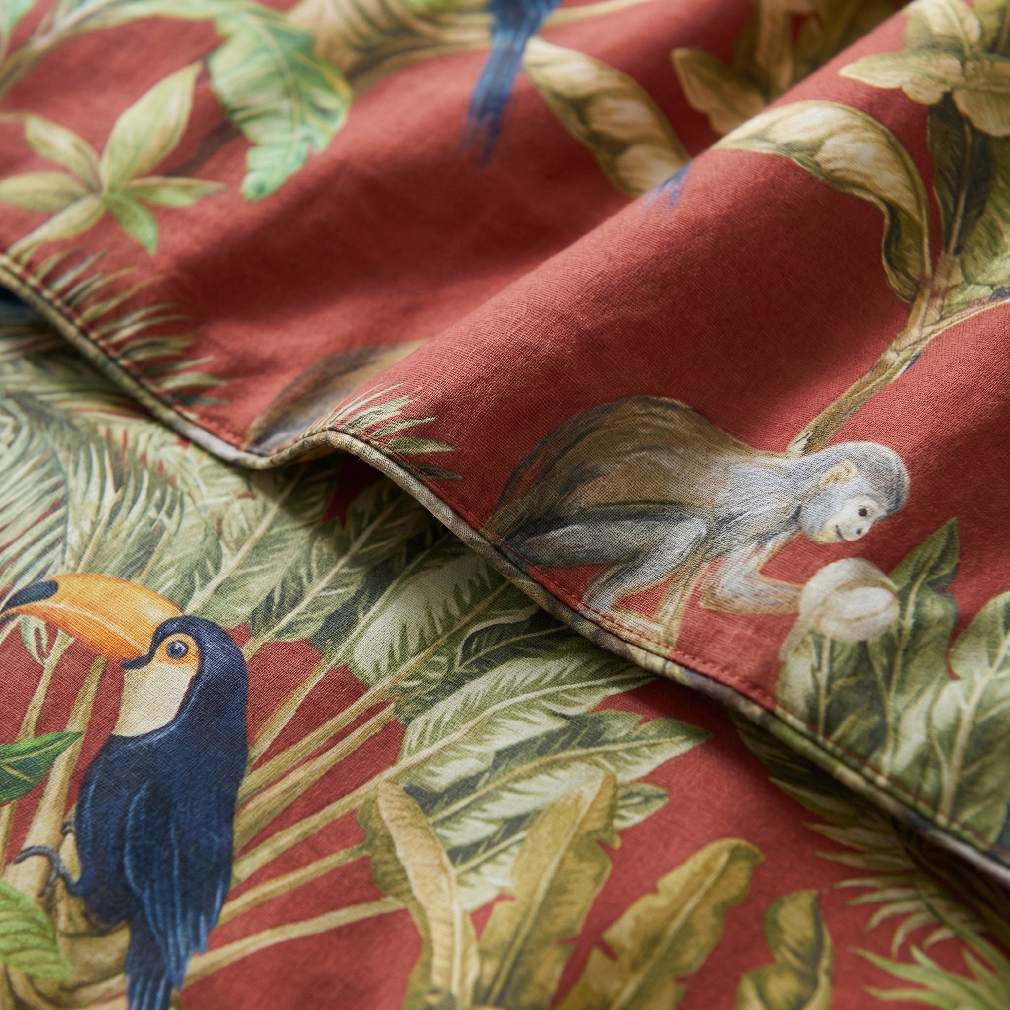 Tucano Red Egyptian cotton bedding set with toucan, monkey, and tropical foliage design.