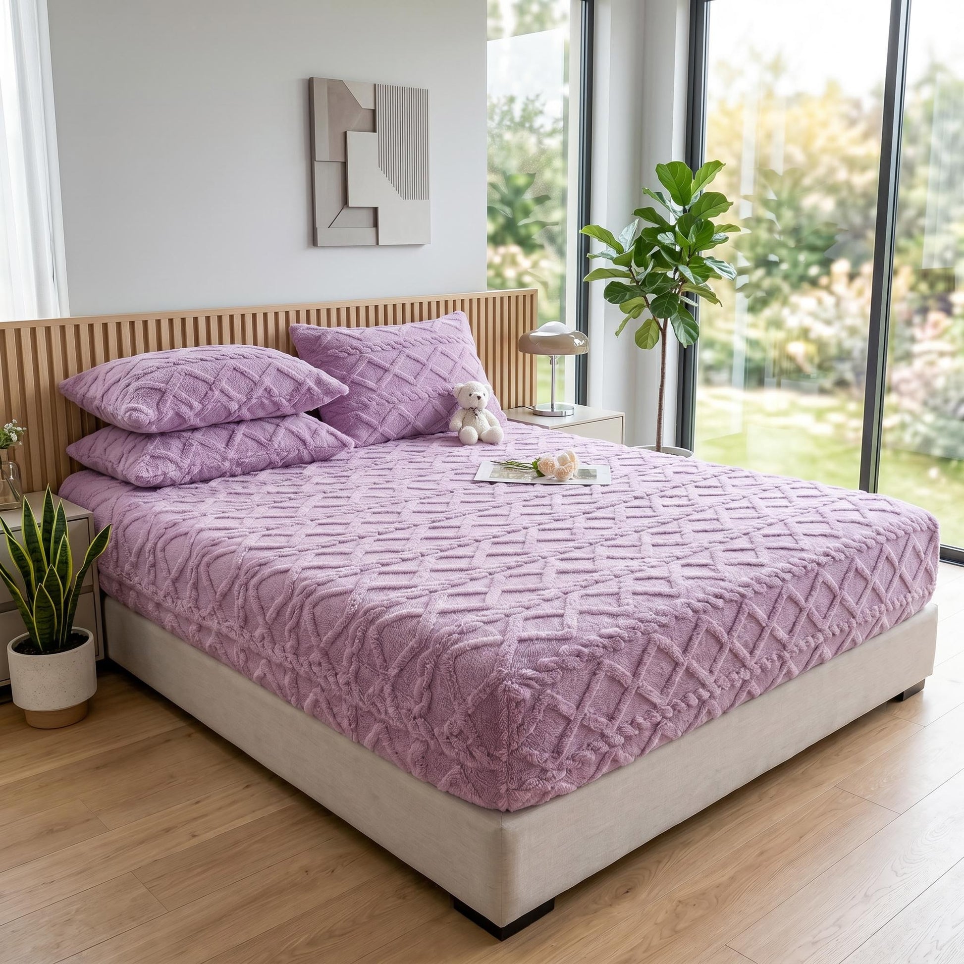 Plush lavender coral fleece fitted bed sheet with a textured ribbed pattern, shown on a bed with matching pillows.