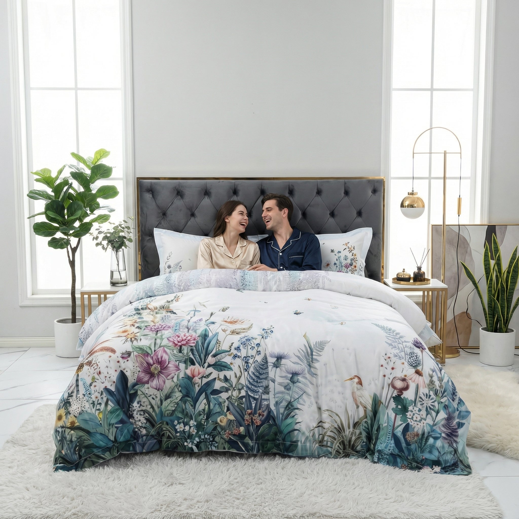 Violet floral cotton bedding set on a Queen bed with a couple, featuring a delicate pattern on a misty grey backdrop.