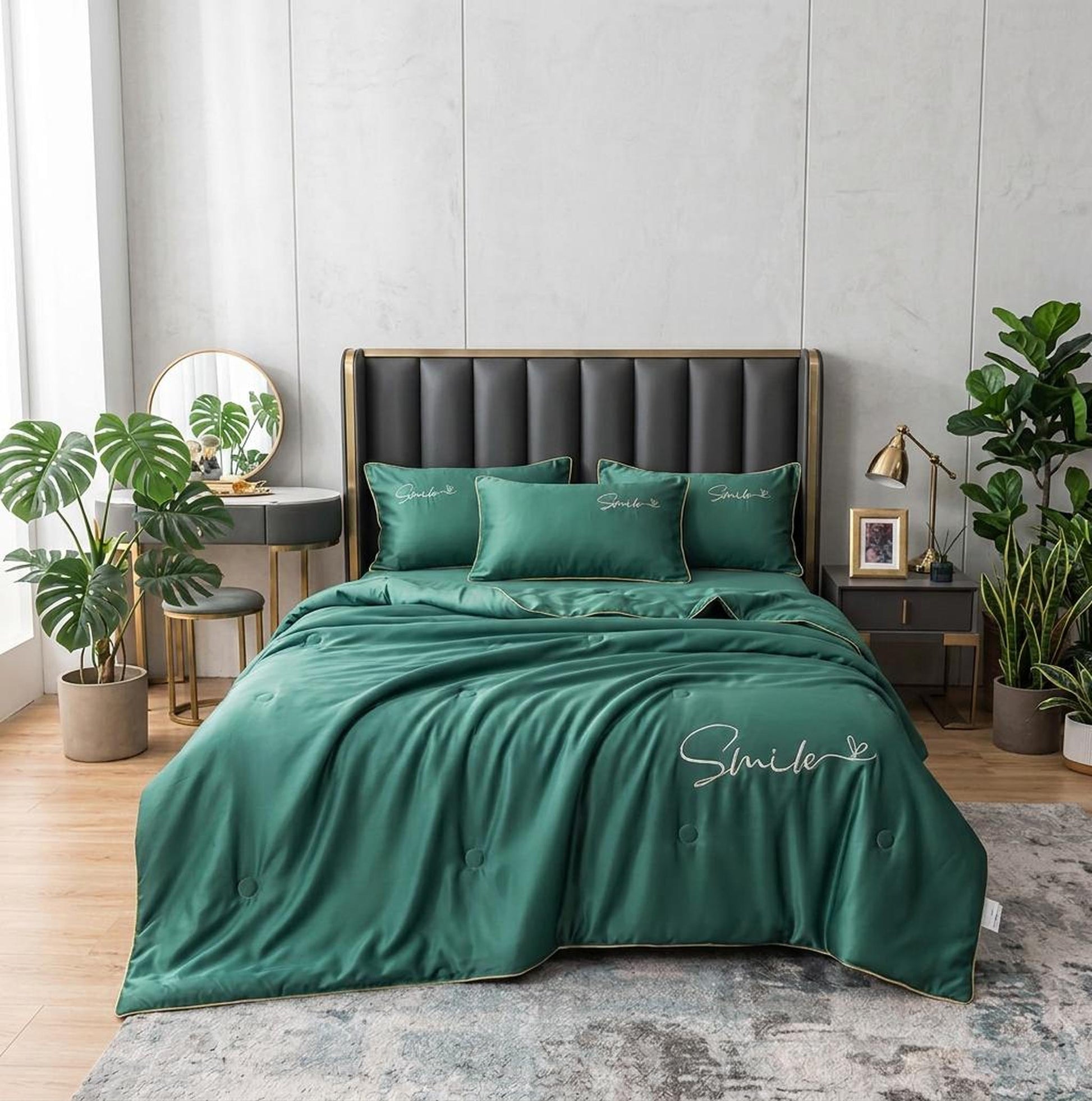 Emerald green washed silk quilt set with "Smile" embroidery on a modern bed.