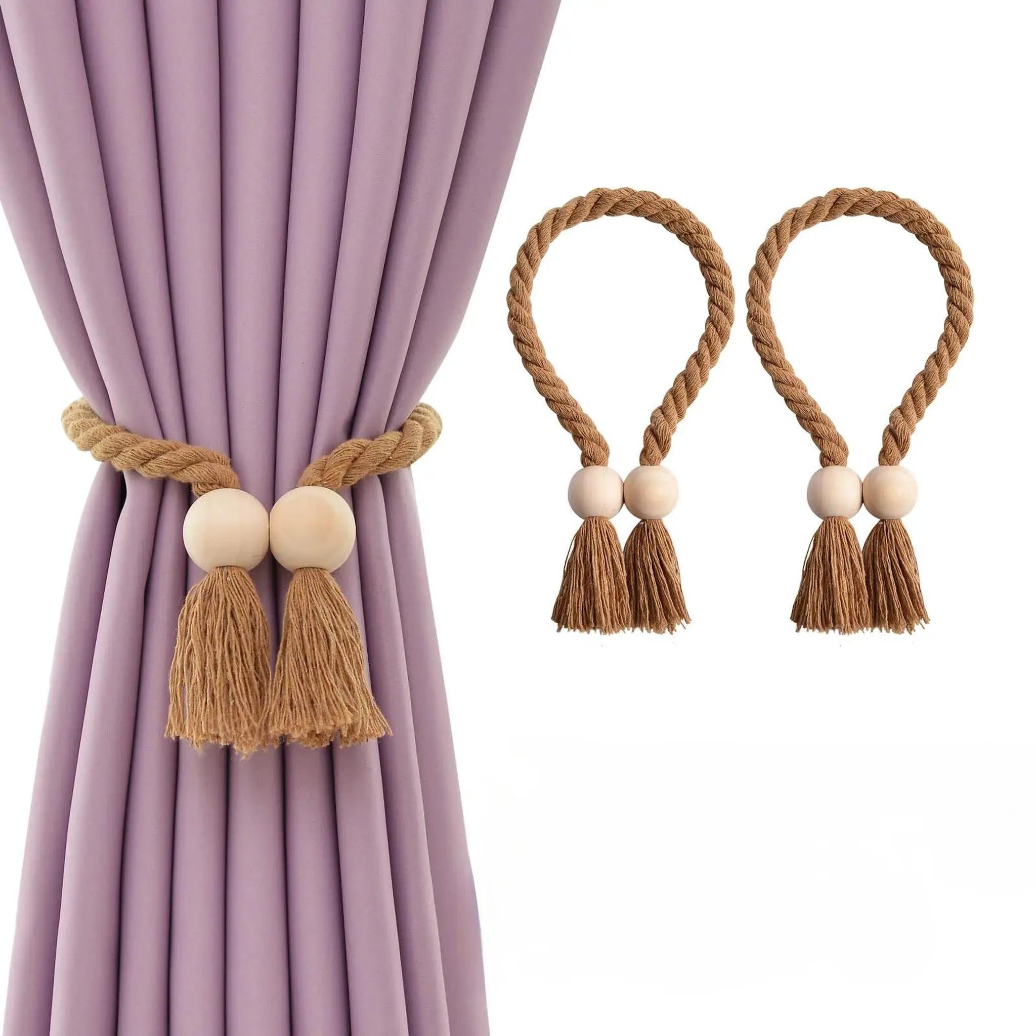 Wooden bead curtain tiebacks with brown braided rope and tassels holding a purple curtain.