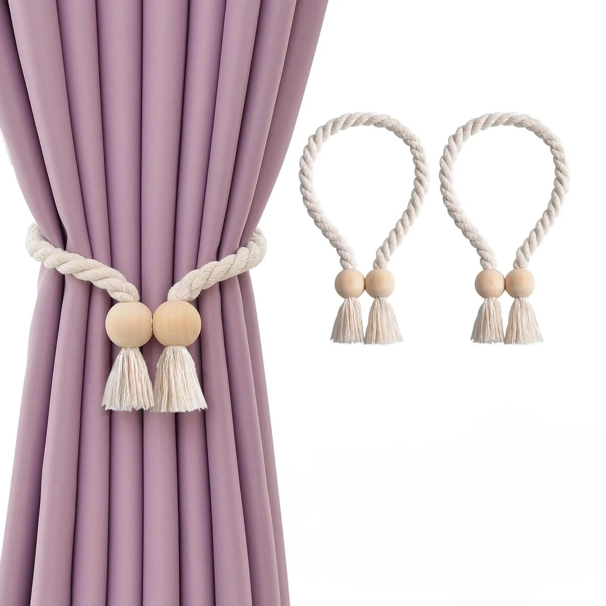 Magnetic wooden bead curtain tiebacks with white cotton rope and tassels on a purple curtain.