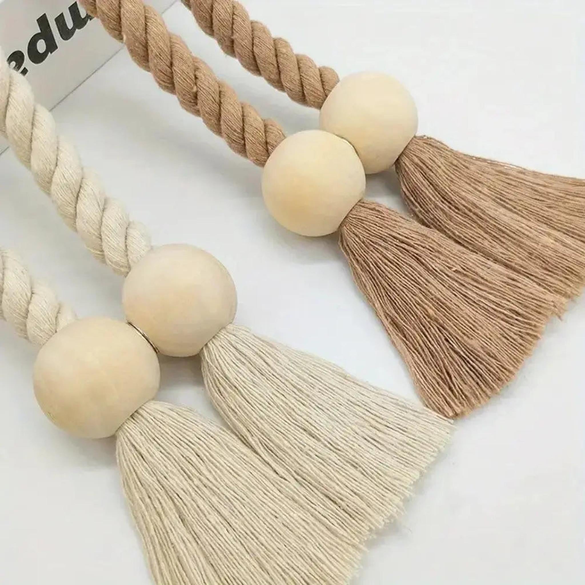 Boho magnetic curtain tiebacks with wooden beads, twisted rope, and tassels in beige and brown.